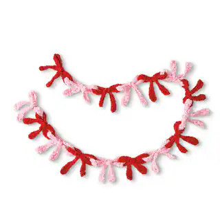 Intermediate Pink & Red Bow Garland Amigurumi Crochet Ornament Kit by Loops & Threads® in Null | 52" x 3" | Michaels® | Michaels Stores