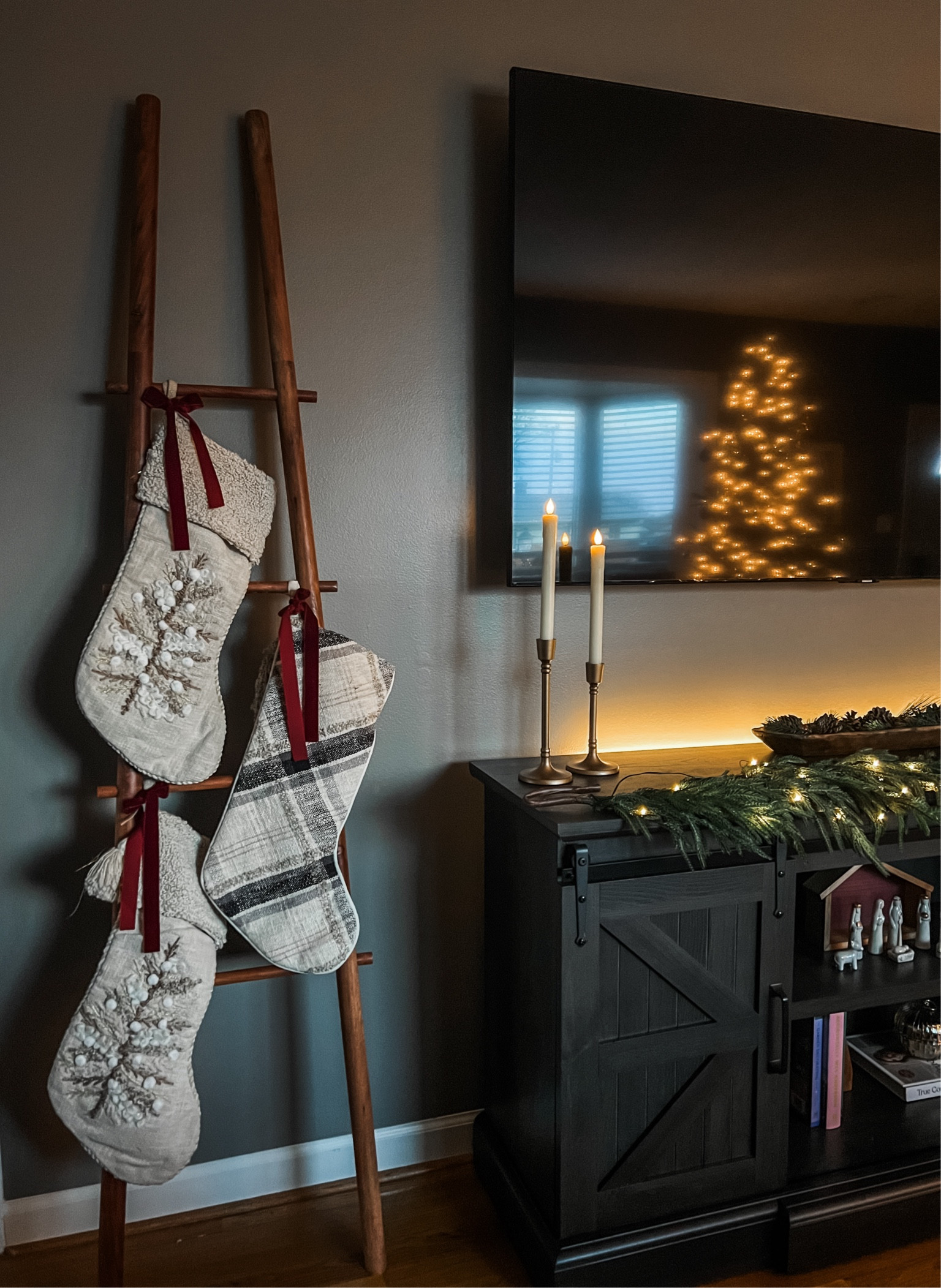 Stocking display and tv stand Christmas decor styling 

Organic Christmas, modern Christmas, natural Christmas, neutral Christmas, Christmas decor, candles, Flameless candles, stockings, ladder decor, Christmas mantle, Christmas shelf styling, gold Christmas decor

#LTKhome #LTKSeasonal #LTKHoliday
