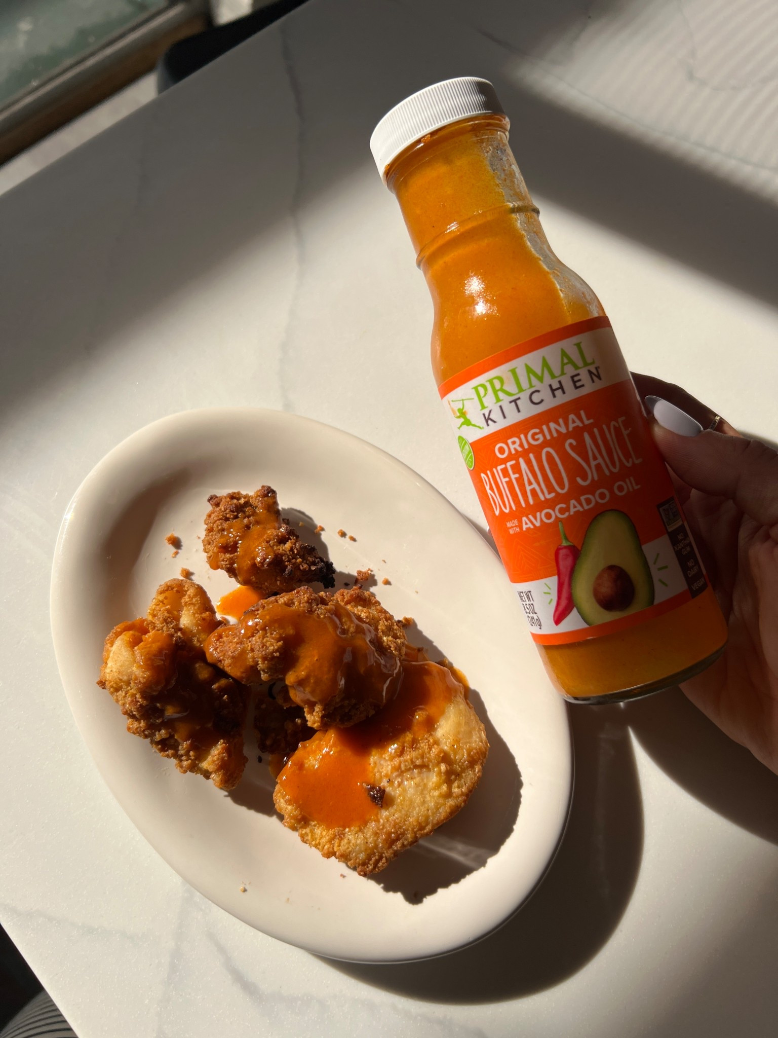 Healthy chick fil a hack!! I know this isn’t the normal content you’d expect to see on my ltk, but this is my healthy snack obsession so I had to share 

I’ve been buying the real good brand chicken nuggets at Walmart and tossing them in this dairy and seed oil free buffalo sauce from primal kitchen - it’s UNREAL

Definitely kicks the craving for a fast food snack, and much healthier ingredients 

#LTKHome