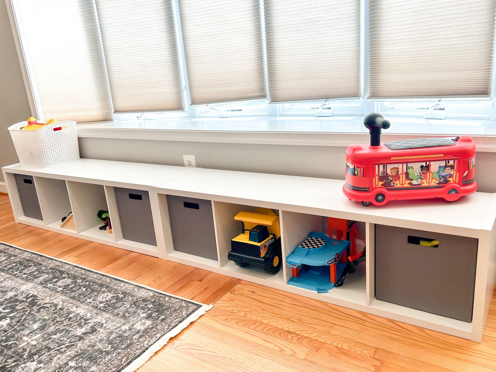 Toy storage for your main living space. Shelves fit perfectly laid horizontally under our bay window!



#LTKHome #LTKFamily #LTKFindsUnder100