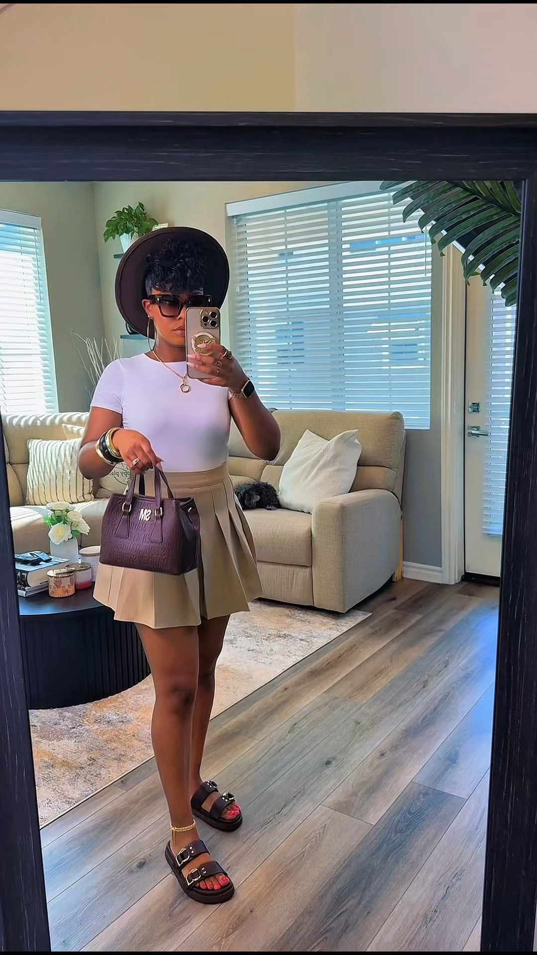 A lot of women think they need more clothes.

Most of the time, they need better styling 🤷🏾‍♀️

This look started with a simple white fitted bodysuit top and a neutral pleated skirt (size small).

Then I added:
✨ Gold and tortoise bangles
✨ Chocolate brown Steve Madden sandals
✨ A matching chocolate brown handbag
✨ Tortoise sunglasses
✨ A brown fedora to tie it all together

By repeating the same rich brown tones throughout the accessories, the entire outfit feels intentional, polished, and put together.

That’s the difference between getting dressed and styling an outfit. 🤎✨

Looking for a fashion stylist? I style virtually and in-person.

#LTKootd #LTKgrwm #LTKSaleAlert
