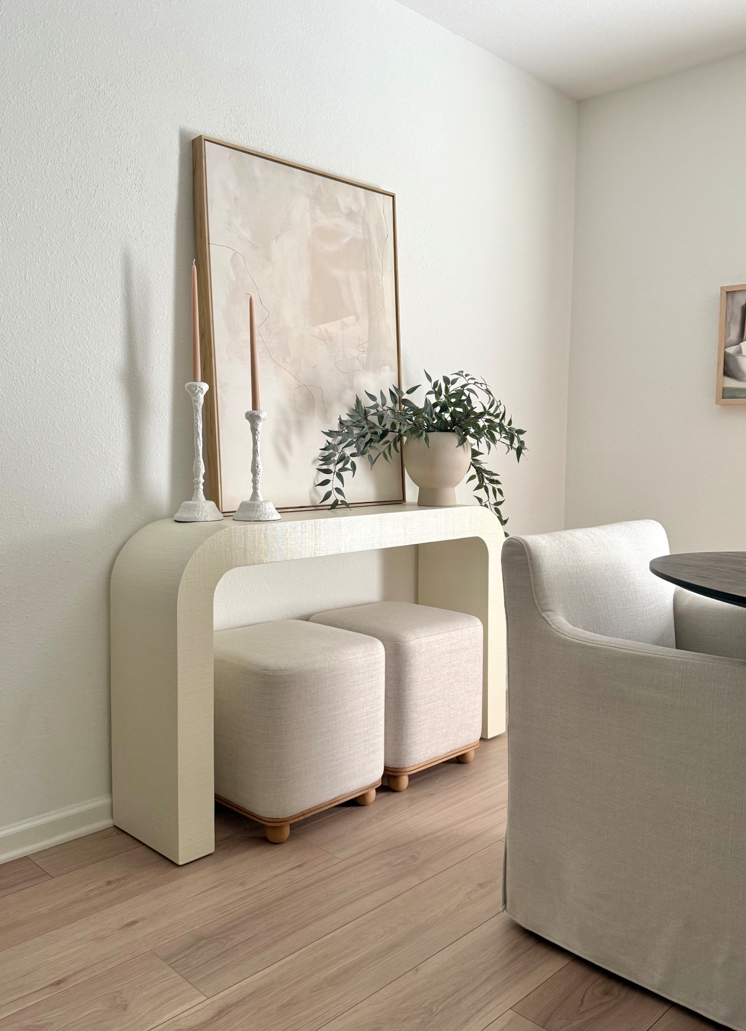 Dining room decor, kitchen decor, abstract canvas art, horseshoe console table, cb2, dining chairs with casters, white candle stick holders, candles, best faux stems, AFloral 

#LTKStyleTip #LTKHome #LTKSaleAlert