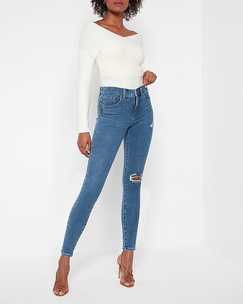 Mid Rise 4-way Hyper Stretch Medium Wash Ripped Skinny Jeans | Express