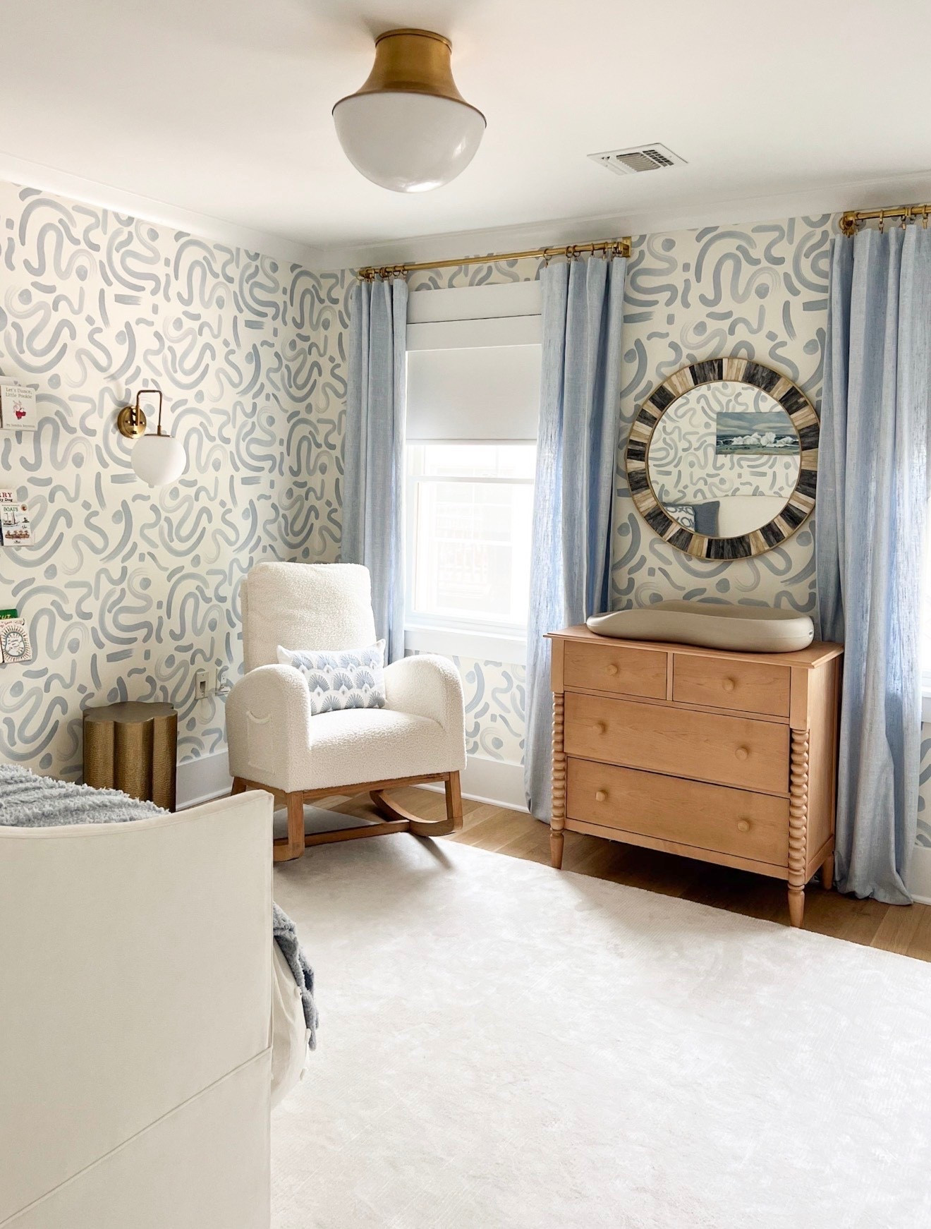 This space feels so fresh and fun without being overwhelming. I love how the soft blue tones and playful wallpaper keep it light, while the warm wood adds just enough contrast. It’s one of those rooms that feels styled but still really livable

kids bedroom ideas, nursery decor, blue nursery, wallpaper nursery, modern kids room, neutral kids room, nursery inspiration, kids room decor, cozy nursery, girlonthehudsonn

#LTKHome #LTKKids #LTKBaby