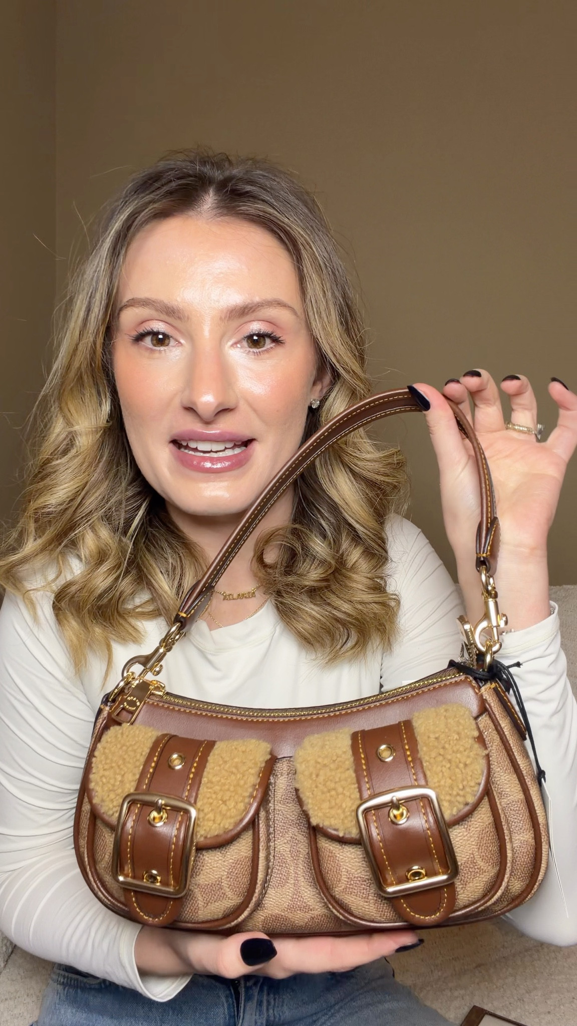 I went to the Coach Outlet to check out the new bags and this one had to come home with me 😍

Coach signature Ashton bag with the front pockets and shearling. I love pops of shearling during the winter and this Ashton bag has the perfect amount without being over the top! I love the shape and color so much!

I got a little card holder wallet that matches as welll

#LTKootd #LTKGiftGuide