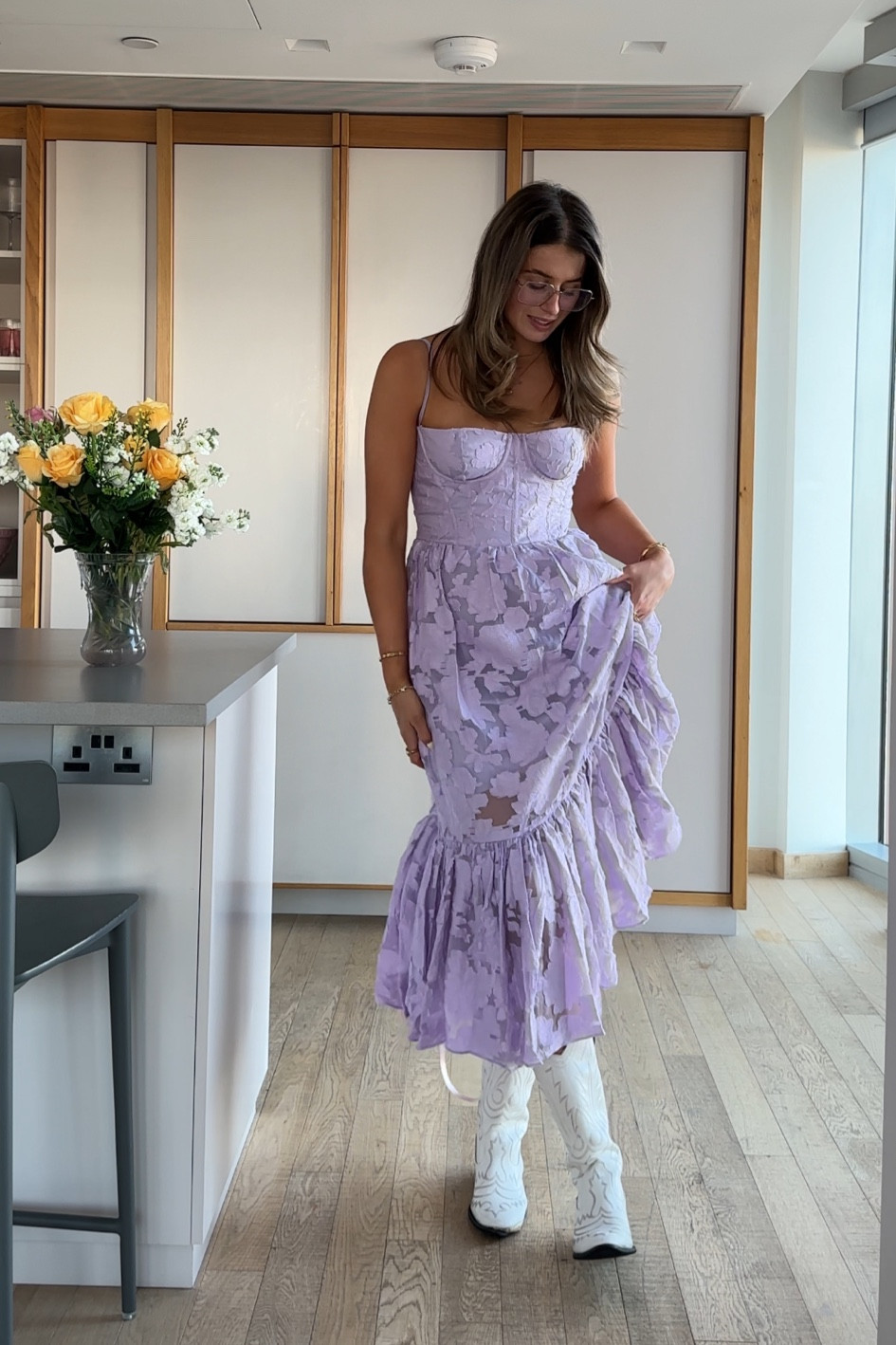 Taylor Swift eras tour outfit Grwm concert outfit inspo, Lilac purple wedding guest dress floral butterflies, corset style midi dress, frilly tiered, lace up, white cowboy boots dia studios asos 

#LTKuk #LTKstyletip #LTKsummer