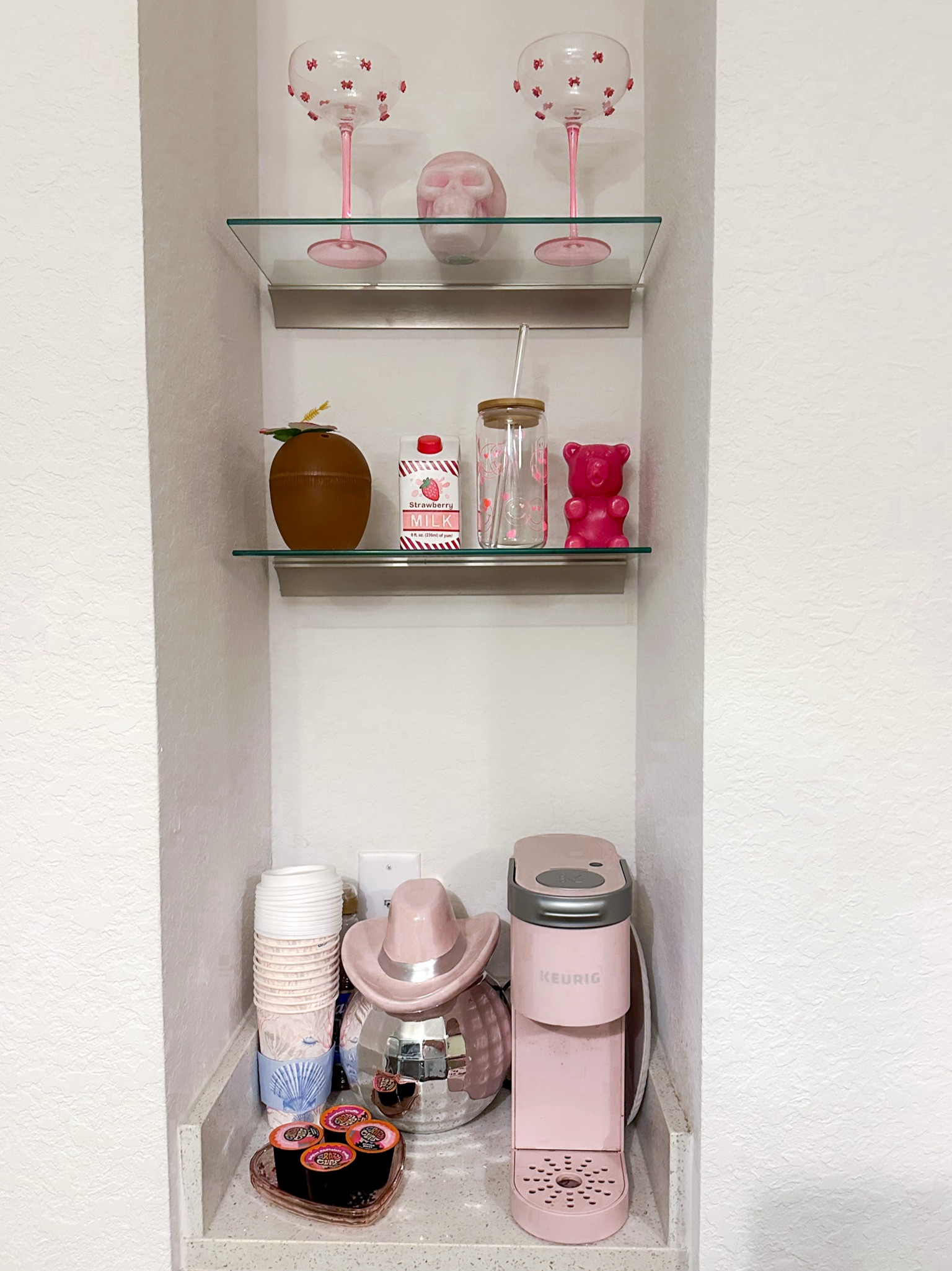 Coffee bar in my apartment! 
Stocked with my favorite coffee Pods, Crazy cups for my pink single use keurig! I added some beachy coastal to go cups
A gummy bear candle
A pink skull candle
Pink bow margarita glasses
Disco cowl girl cook jar to store my pods
This makes the perfect girly apartment decor  

#LTKSeasonal #LTKhome #LTKtravel