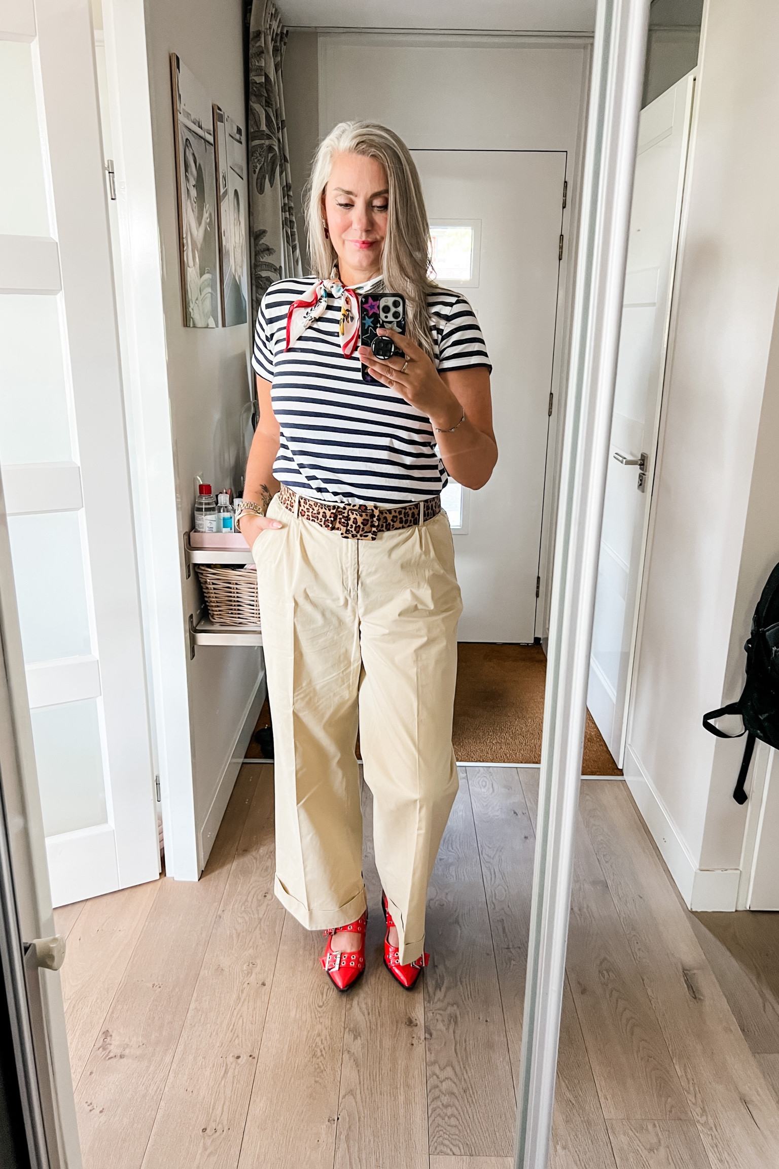 Ootd - Thursday. A little Parisian chic in a striped t-shirt, leopard belt, scarf and wide legged chinos (Hema) with red patent slingback shoes. Red bow and pearl earrings. 



#LTKnederlands #LTKeurope #LTKworkwear