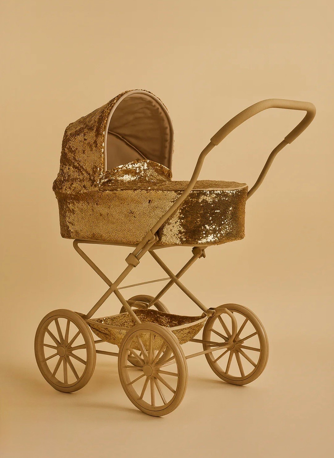 The stroller of my little girl's magical dreams. ✨

I have yet to find a doll stroller quite as beautiful as this one. Every detail feels thoughtfully crafted, from the shimmering gold sequins to the heirloom-quality design. It's one of those toys that somehow makes playtime feel even more whimsical.

I love pieces that encourage imaginative play, and this stroller has quickly become a favorite for walks around the yard, collecting treasures, and taking beloved dolls on endless adventures.

Unfortunately, this exact stroller is currently out of stock, but if you're anything like me, it's worth keeping an eye on. Beautiful pieces like this tend to find their way back eventually.

In the meantime, I've linked a few similar doll strollers that capture the same magical, storybook feel. They're all equally charming and perfect for little ones who love imaginative play as much as mine does.

Sometimes the most treasured toys aren't the ones that light up or make noise—they're the ones that inspire a little extra wonder. ✨🤍
#LTKFamily #DollStroller #PretendPlay #ImaginativePlay #WhimsicalChildhood #MagicOfChildhood #HeirloomToys #WoodenToys #OpenEndedPlay #ToddlerGirl #ToddlerMom #MomFinds #ToyInspiration #ChildhoodUnplugged

#LTKKids #LTKKids #LTKmomlife #LTKdayinmylife