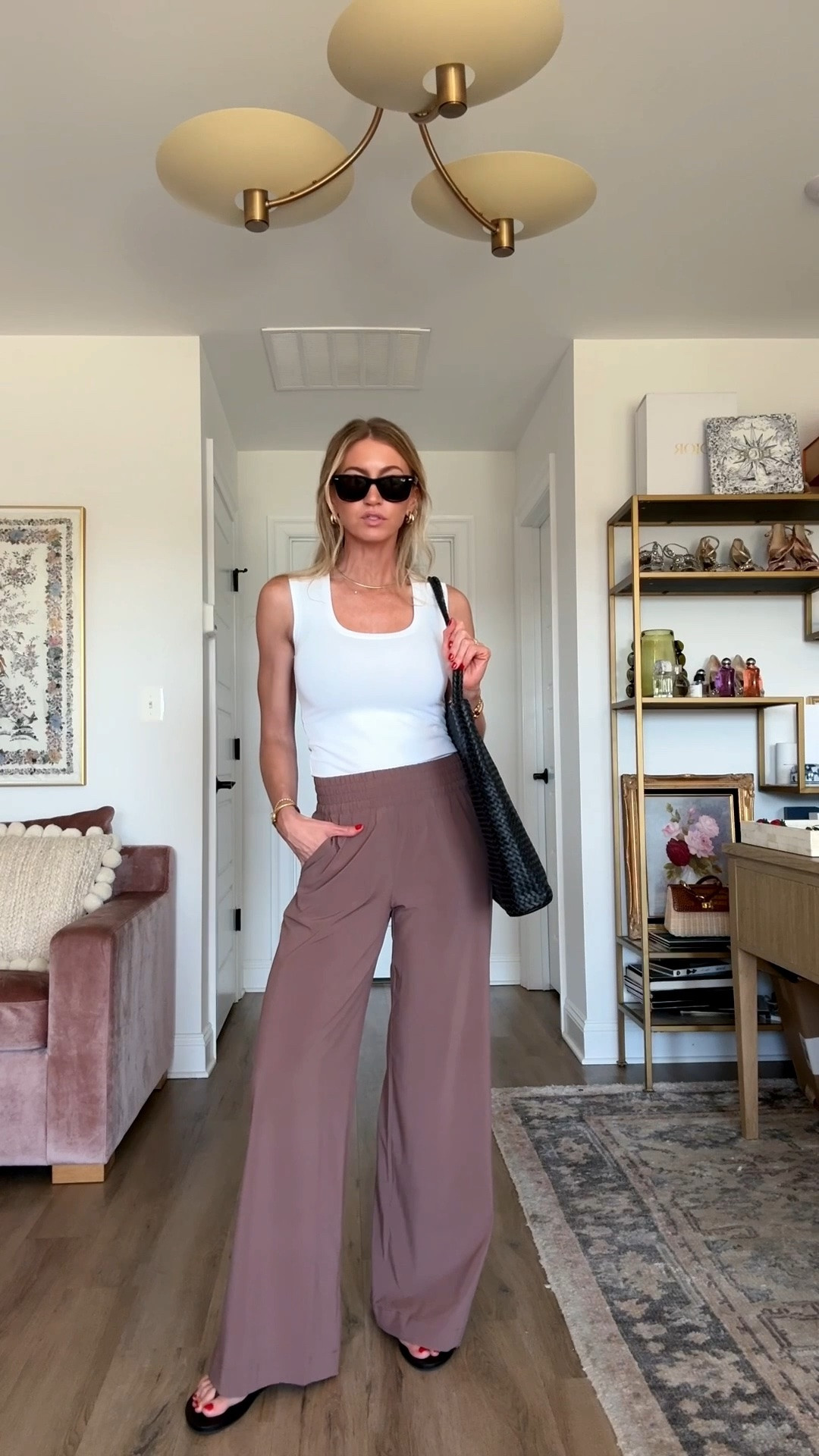Styling my Picky Girl white tank and travel pants for a simple chic travel look. 

White tank: runs TTS, wearing an XS in the long length. 

Pants: runs TTS slightly big, wearing XS in the reg length. 

Sandals run small, size up if in between living.

#LTKootd #LTKTravel #LTKgrwm