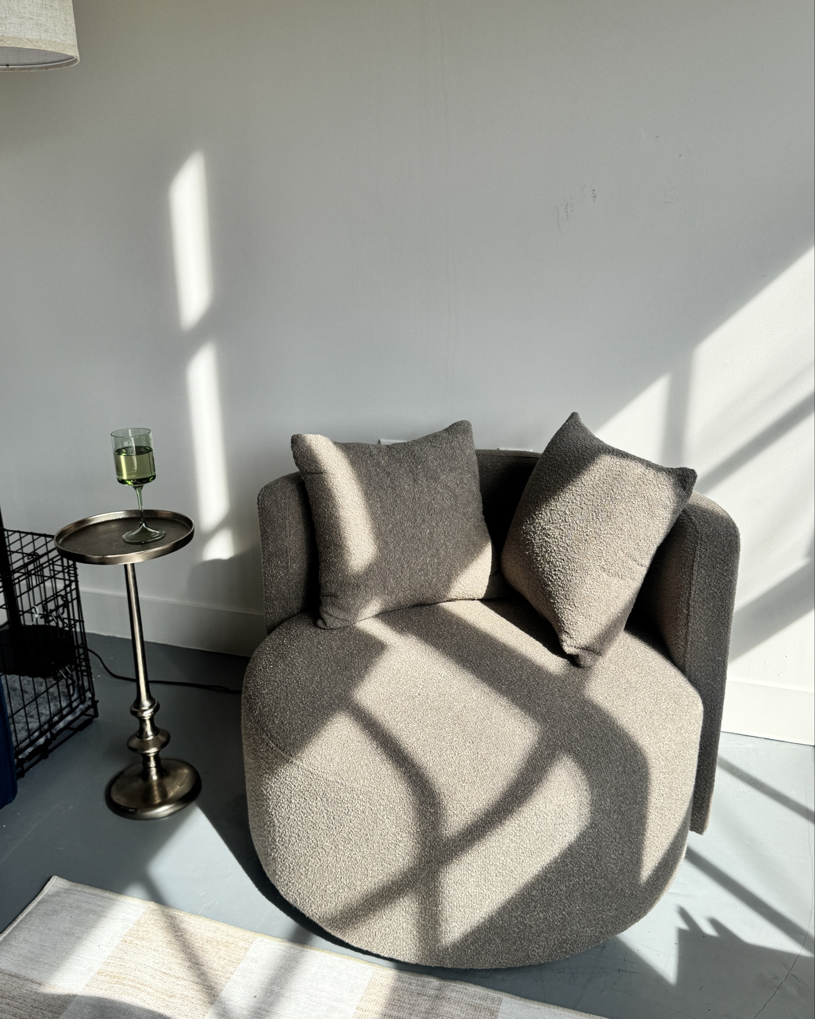 Brown circle couch chair cozy aesthetic, coffee table,  checkered rug, full size mirror, overhead lamp light tones

#LTKHome #LTKStyleTip