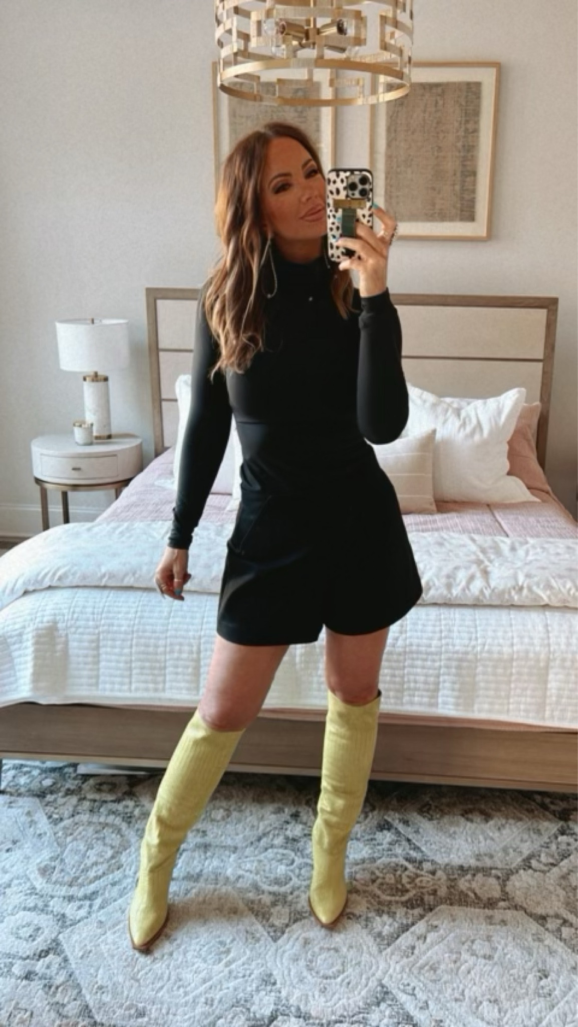 Spanx - code BETSYXSPANX - I’m wearing a medium in the black turtle neck bodysuit, and a medium in the A-line shorts. Boots are from Free People. Jewelry from Goldie Lew. 

#LTKstyletip #LTKsalealert #LTKFind