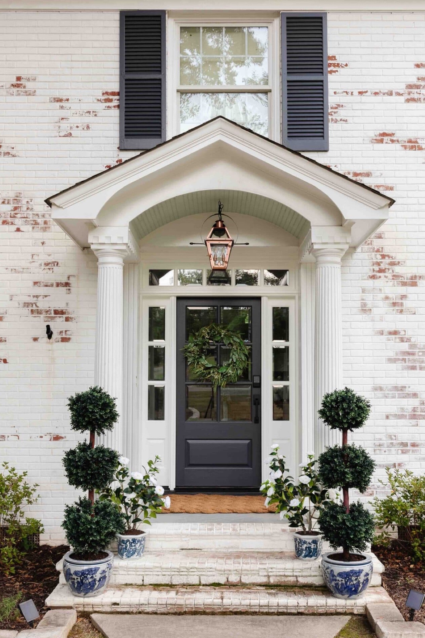 Our refreshed front porch! 

#FrontPorchDecor #Topiary #chinoiserie 

#LTKSeasonal #LTKHome
