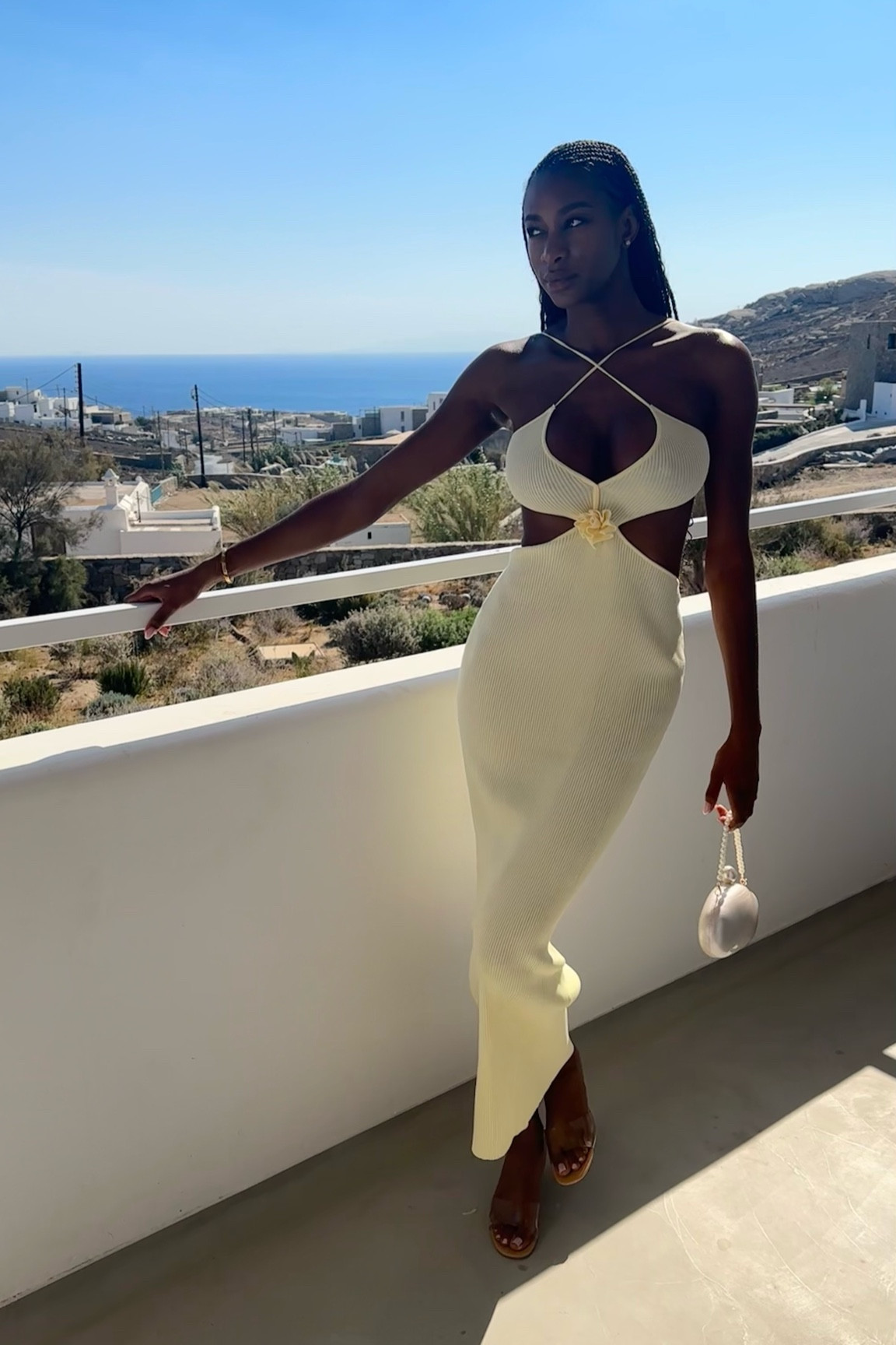 Serving looks and vibes in Mykonos 🌴✨ This dress and I? A match made in paradise. 💁🏾‍♀️ Explore my short but sweet Mykonos travel guide—link in social bio! Hair by @_touchedbyishie_ on instagram 🙃 

#LTKTravel