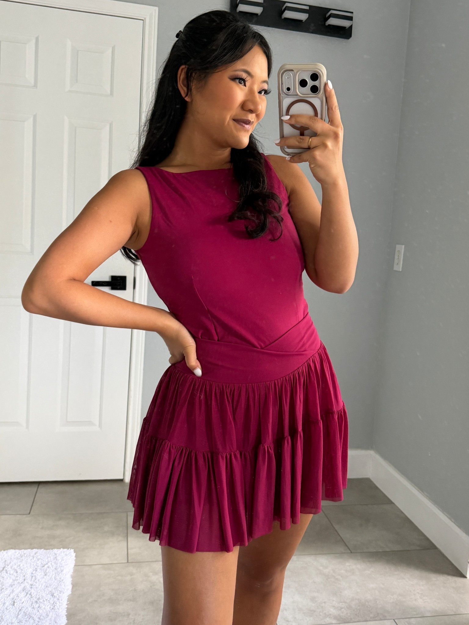 Blogilates Women's Ballerina Skort wearing size medium. Blogilates Women's Boatneck Crisscross Tank Top wearing size large. Blogilates Women's Marshmallow Full Zip Hooded Sweatshirt wearing size medium. 

