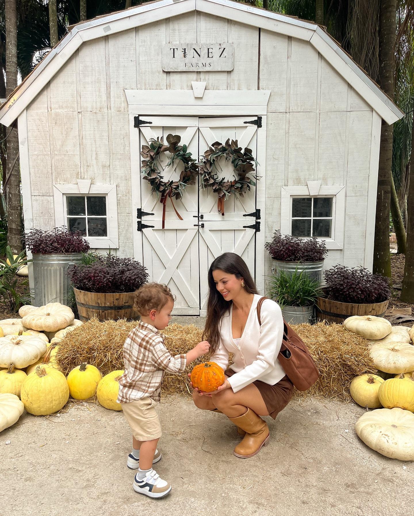 Pumpkin patch outing with the family🥰🍁🍂💛 Wyatt had the best time at @tinezfarms!

Brown suede skirt, white cardigan, flannel, fall outfit, chocolate brown, toddler outfit, brown suede tote, chunky heel boots, fall boots