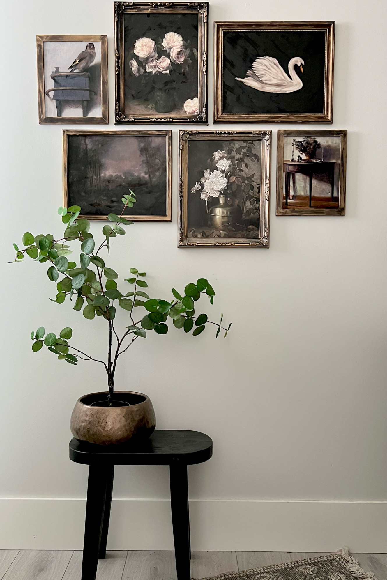 My moody little gallery wall in my powder room! 
4 11x14
2 8x10
I used rub n buff on black frames ! 