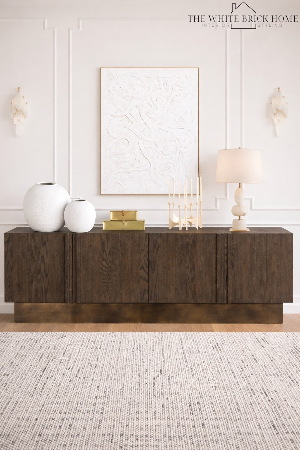 A beautiful wall of a dining room that layers rich wood tones and soft, organic lines to create an elevated room for hosting and family time. 

🖤🖤

Dining room, dining room decor, dining room furniture, buffet table, dining room design, dining room wall trim, dining room lighting, wall sconces, table lamp, home decor, home design, vase, home accents, stacked boxes, decor ideas, wayfair, Amazon, crate and barrel, cb2 


#LTKHome #LTKSaleAlert #LTKSeasonal
