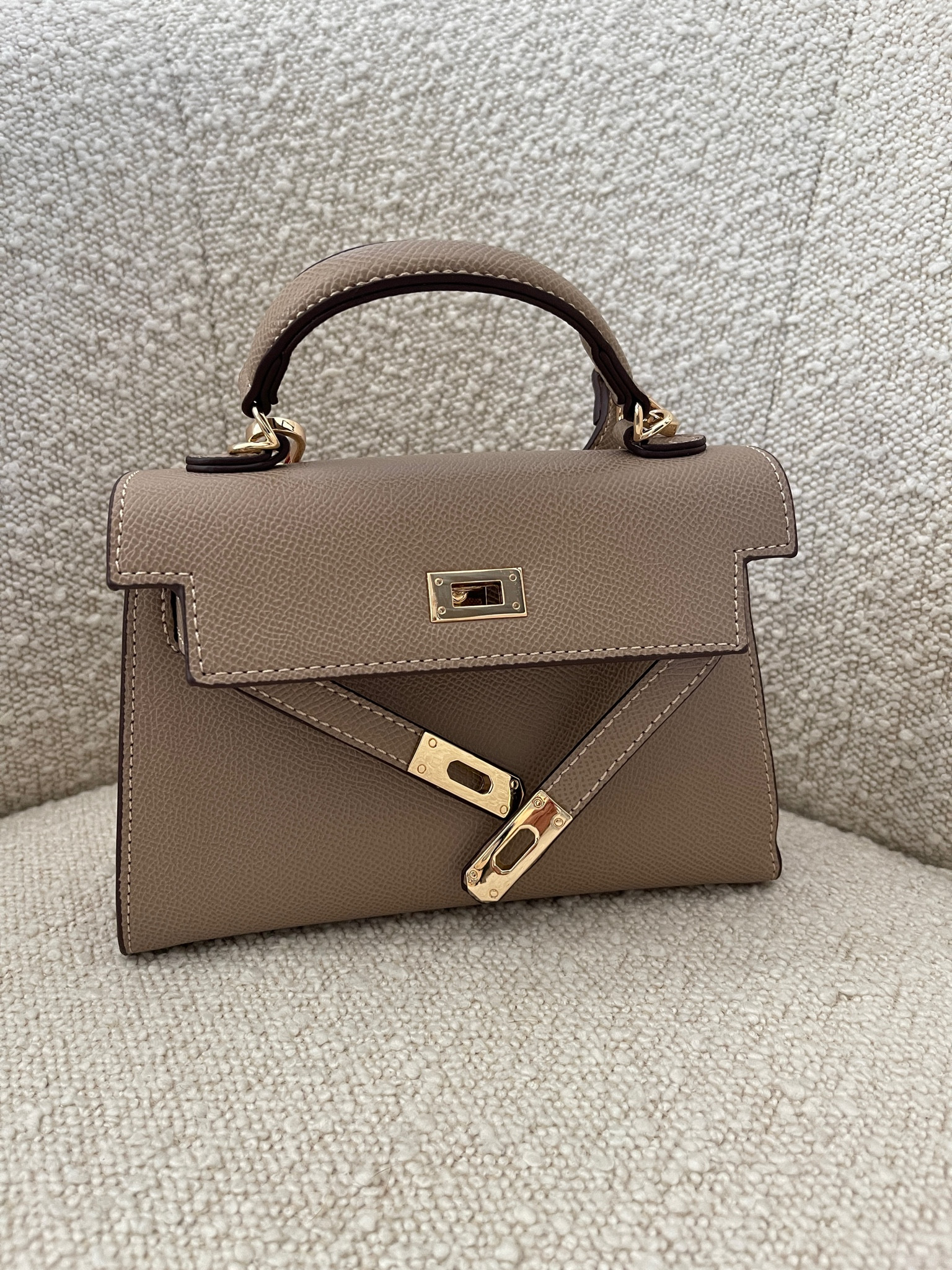 Amazon find! How cute is this mini purse! Looks like designer and I love that comes with a crossbody strap. Comes in other colors!

#LTKitbag #LTKU #LTKfindsunder100