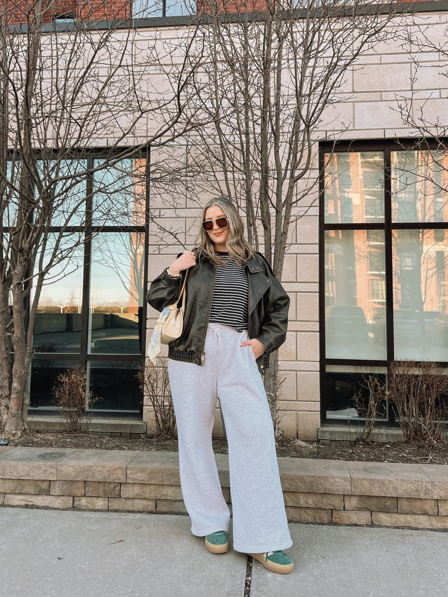 Comfy casual spring outfit! Wearing my usual size L in the wide leg sweatpants (I love the thick material of these!) and L in the leather jacket. Sized up to XL in the tee cause I have a larger chest. Bag and scarf are Old Navy, Canadian links under “similar products”. Adidas gazelle sneakers run a little big, I’m a 9.5-10 and wear a 9.

#LTKmidsize #LTKstyletip