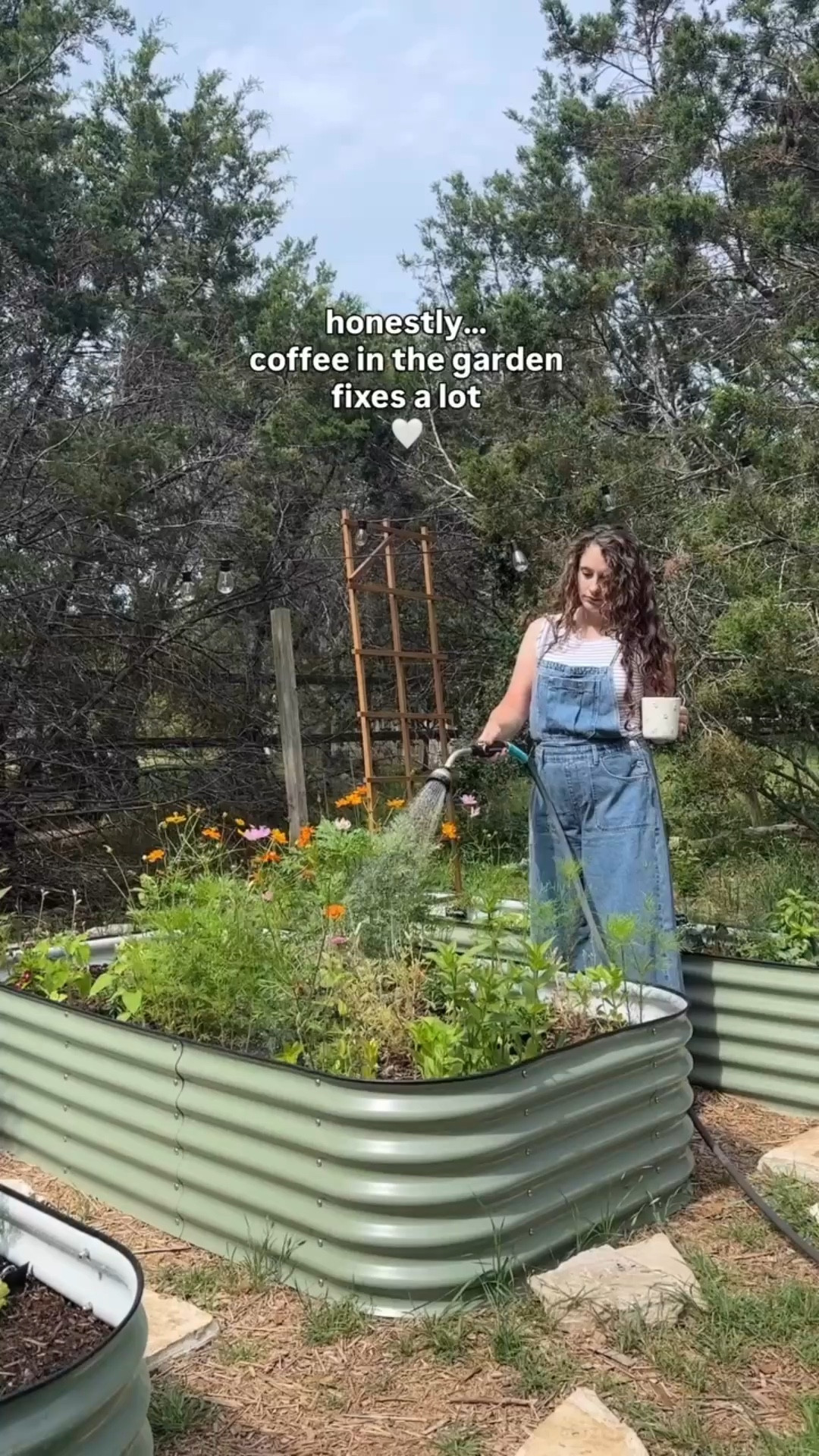 There’s something about stepping outside with coffee and checking on the garden that instantly slows everything down.

Maybe it’s the quiet.
Maybe it’s watching things grow.

Either way… it helps. 

#gardentherapy
#gardenlife #gardeningmom

#LTKSeasonal #LTKmomlife #LTKootd