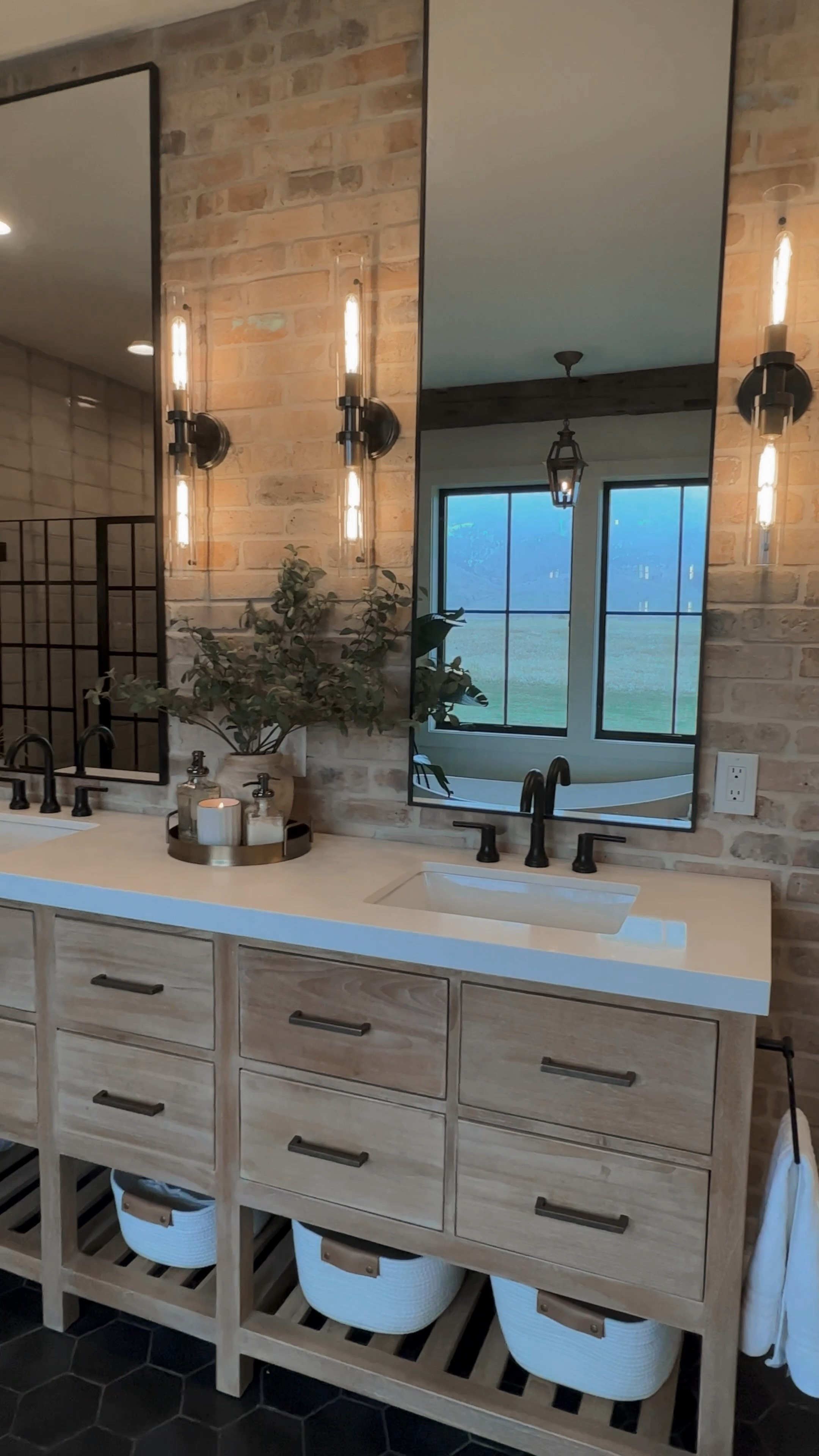A little master bathroom love today!  All the details of the space are below.

.

I LOVE this room and how all of the pieces came together. Here are all of my favorites…

1. The HUGE 84” vanity in whitewashed teak with the open storage in the bottom. It’s just lovely and was one of the few options that we could find that would fit the space well. 
2. I LOVE the brick wall and it really ties together with the brick herringbone floor in our foyer.
3. Third is the wooden stump by the bath… it’s just so functional (especially because our toddler bathes in this bath every night, so we use it a LOT!). 
4. And last is the black shaker bench in the corner — we use it before and after showers, and for watching our kiddo at bath time!

Here’s all the deets of the space!

Vanity: @willowbathandvanity Parker Solid Teak 84” Wood
Faucets: @deltafaucet Trinsic Two Handle Widespread Bathroom Faucet
Brick: @bricksalvage Chicago Antique Thin Brick Veneer Farmhouse Flooring



Boujee on a Budget | Home Decor | Amazon Find | Neutral Home | Brick Wall | Modern Organic | Interior Design | House Styling | Home Design

#boujeeonabudget
#amazonfind
#a e s t h e t i c 
#homedecor
#homedesign
#homesweethome
#home
#affordablehomedecor
#homeinspo
#neutralhome
#boxinaboxforyou

#LTKVideo #LTKHome