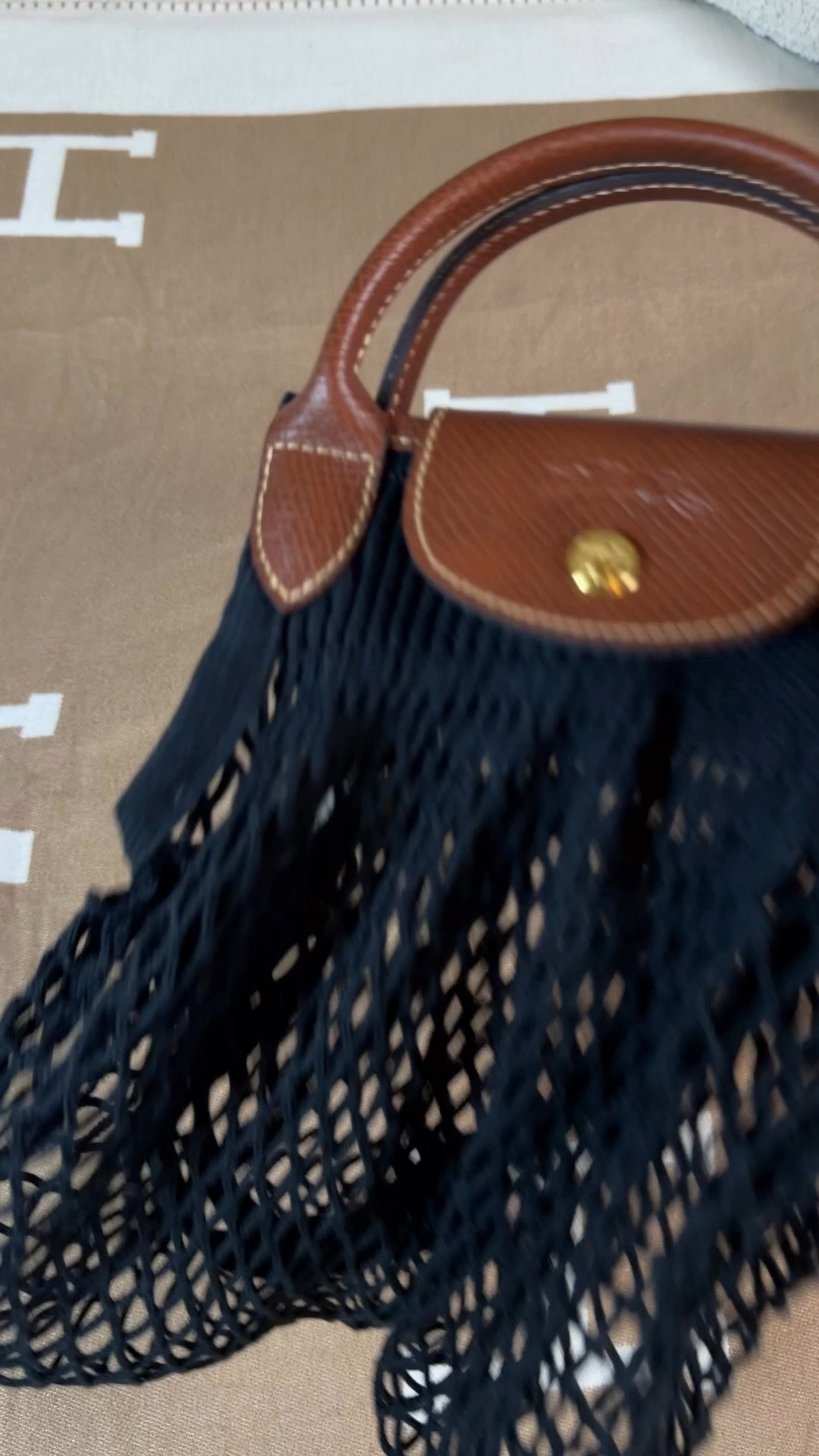 What fits in the Longchamp Le filet 🖤

This is the perfect bag for summer with its mermaid beachy vibes 🏖️ I love the combination of fish net like material with the classic Longchamp Le Pliage leather and strap. 

You can wear this net bag as a hand bag or use its shoulder straps. I also just tried the Longchamp crossbody strap kit on it and it works great!

What’s in my bag:
Longchamp Le filet bag inset. Ties into the netting so easily!
Mini coin pouch
Light up compact mirror
Elf lip gloss
Elf suntouchable whoa glow, tinted sunscreen 
Sol de janeiro body spray 62
And body butter
Tula spresso under eye brightening balm
Touchland hand sanitizer
Sherpani RFID anti theft wallet
French pin 
Jane Austen notebook
Salt and stone hand cream
Flexible claw clip


#LTKootd #LTKSwim #LTKTravel