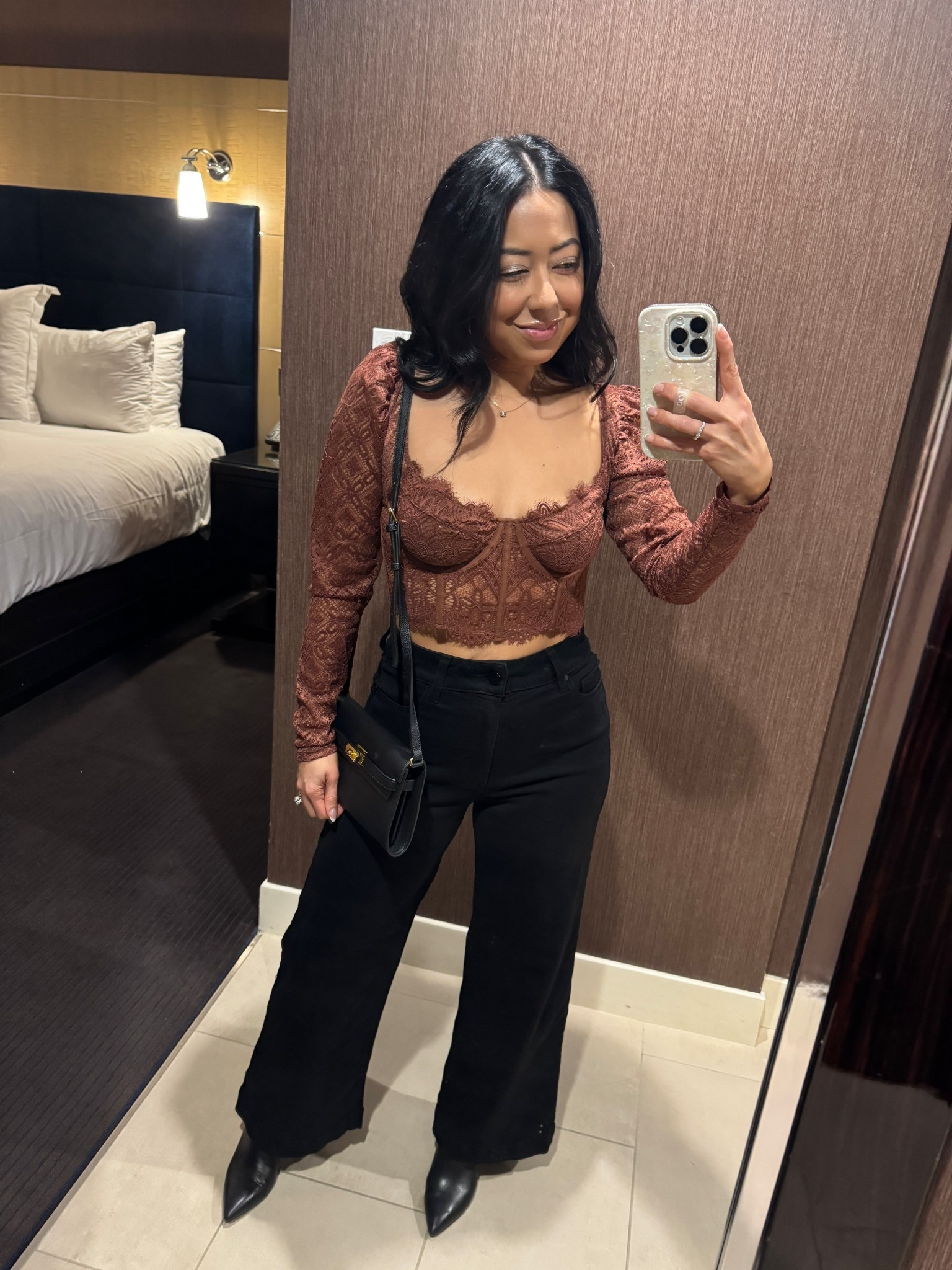 Date night in Las Vegas 🎰🎲
Loveeee this outfit!
Lace bustier top is Anthropologie. Size small (round a tiny big but in my true size). 
Wearing nippies underneath (it is a bit sheer). 
Paige black wide leg denim pants - OBSESSED with these. Size 25 petite (run big… size down 1. They are very stretchy). 
Black pointed toe leather block heel booties. These are Steve Madden and go with everything and pretty comfy for a heeled bootie. 
Bag is Amazon (so good for a night out). 
Hoop earrings, necklace linked. 

#LTKPetite #LTKTravel #LTKmomlife