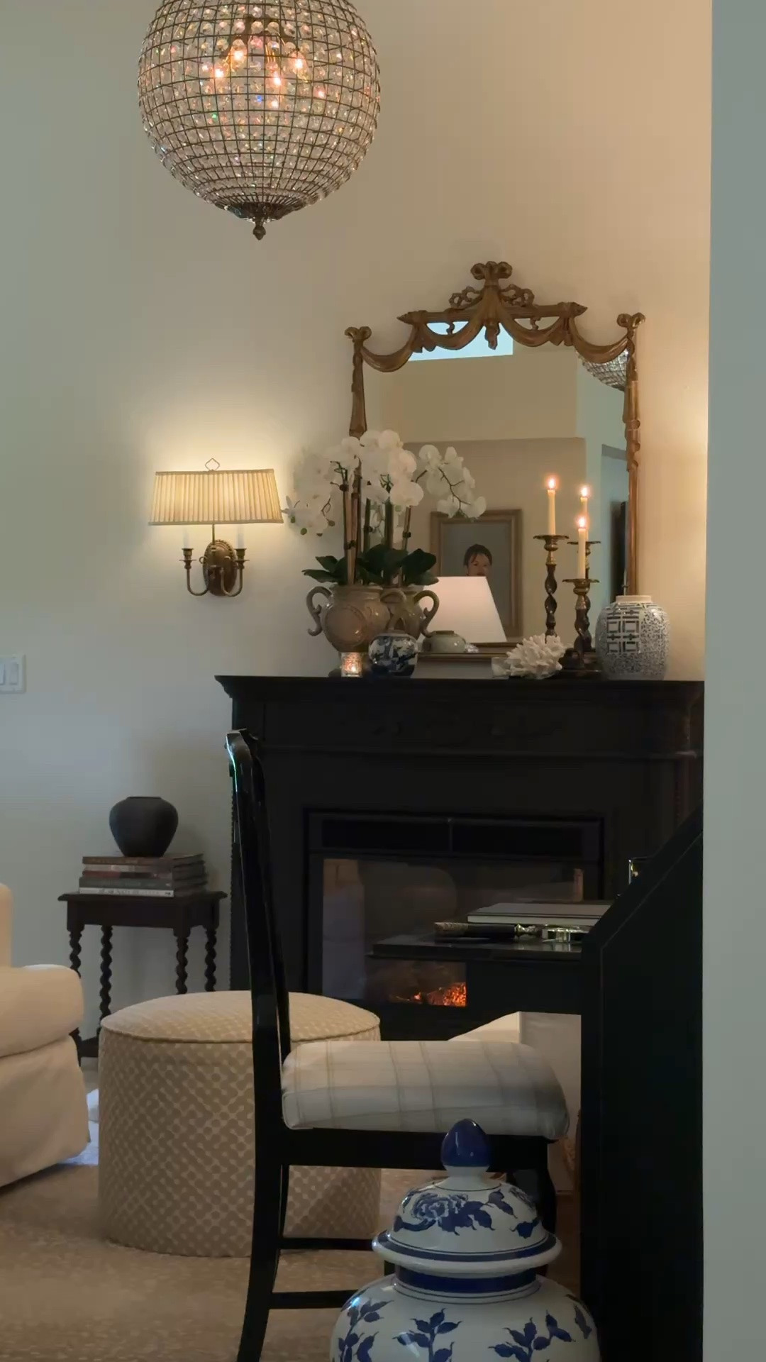 A few of the pieces that make our sitting room feel collected and layered.  Gold wall sconces, a barley twist accent table, black ceramic urn vase, vintage-inspired barley twist candlesticks, an antique bronze crystal pendant light, and slipcovered swivel chairs—all pieces that bring warmth, texture & traditional character to the room.

#LTKHome