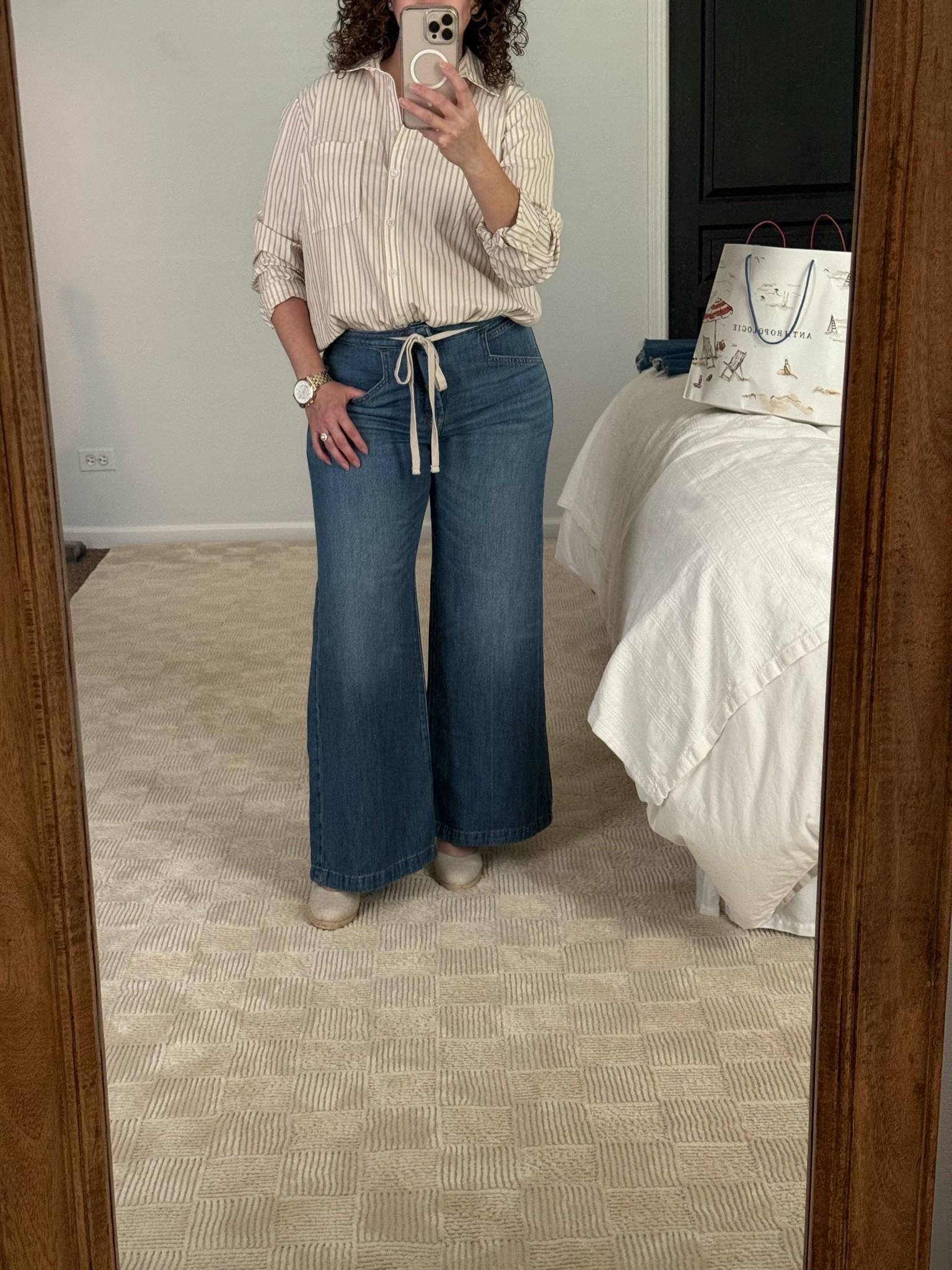 Doing a try on of clothes I bought recently. Loving this lightweight denim and striped button down from Anthro! Love the belted detail. Denim available in regular and petite lengths. I’m 5’2” and currently wearing a petite length with a wedge shoe but could comfortably wear it with a flat as well. This outfit is so comfy. I may wear it on the plane while traveling. ￼

#LTKOver40 #LTKPetite
