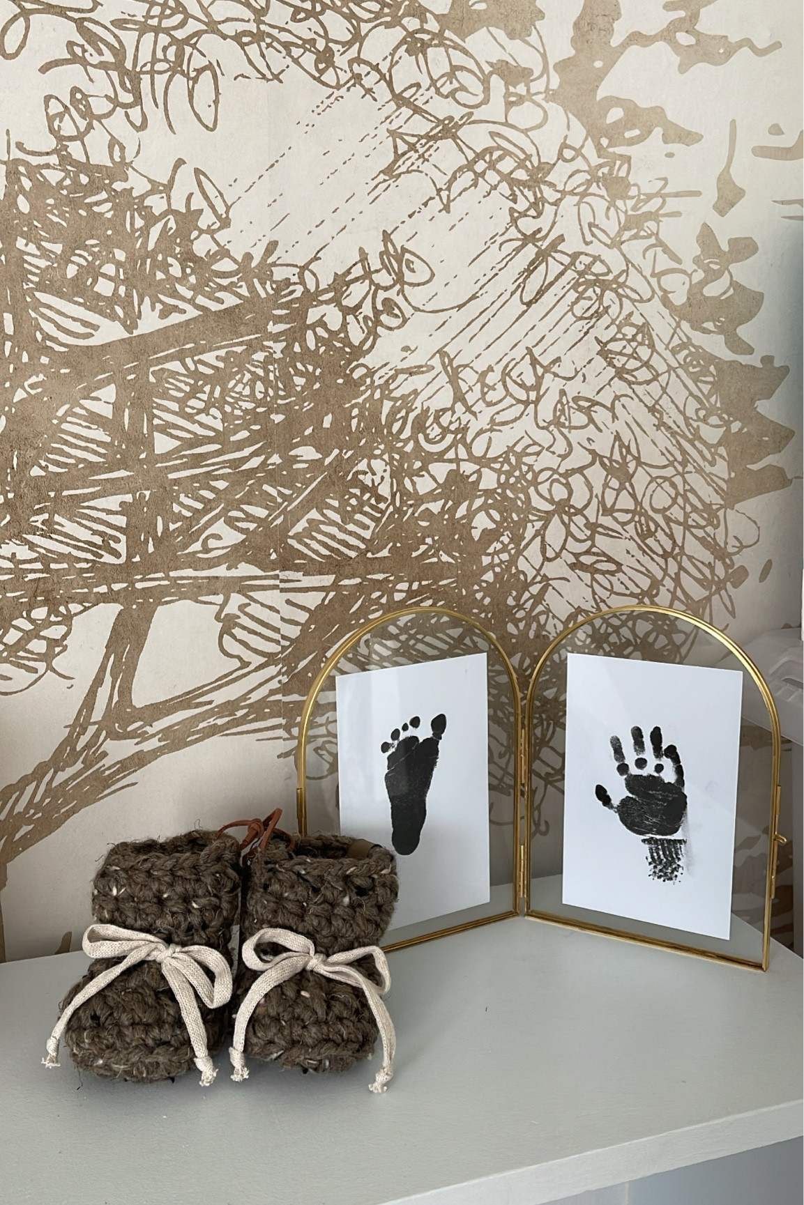 Hand & foot print memories in baby boy’s nursery 