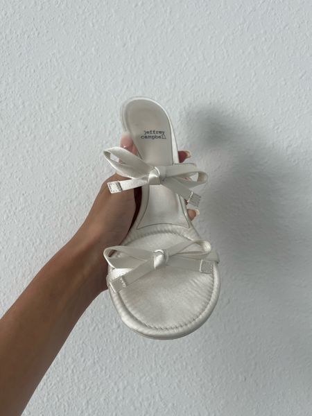 Jeffrey Campbell x Anthropologie white bow sandals 

#LTKWedding #LTKBeauty #LTKShoeCrush