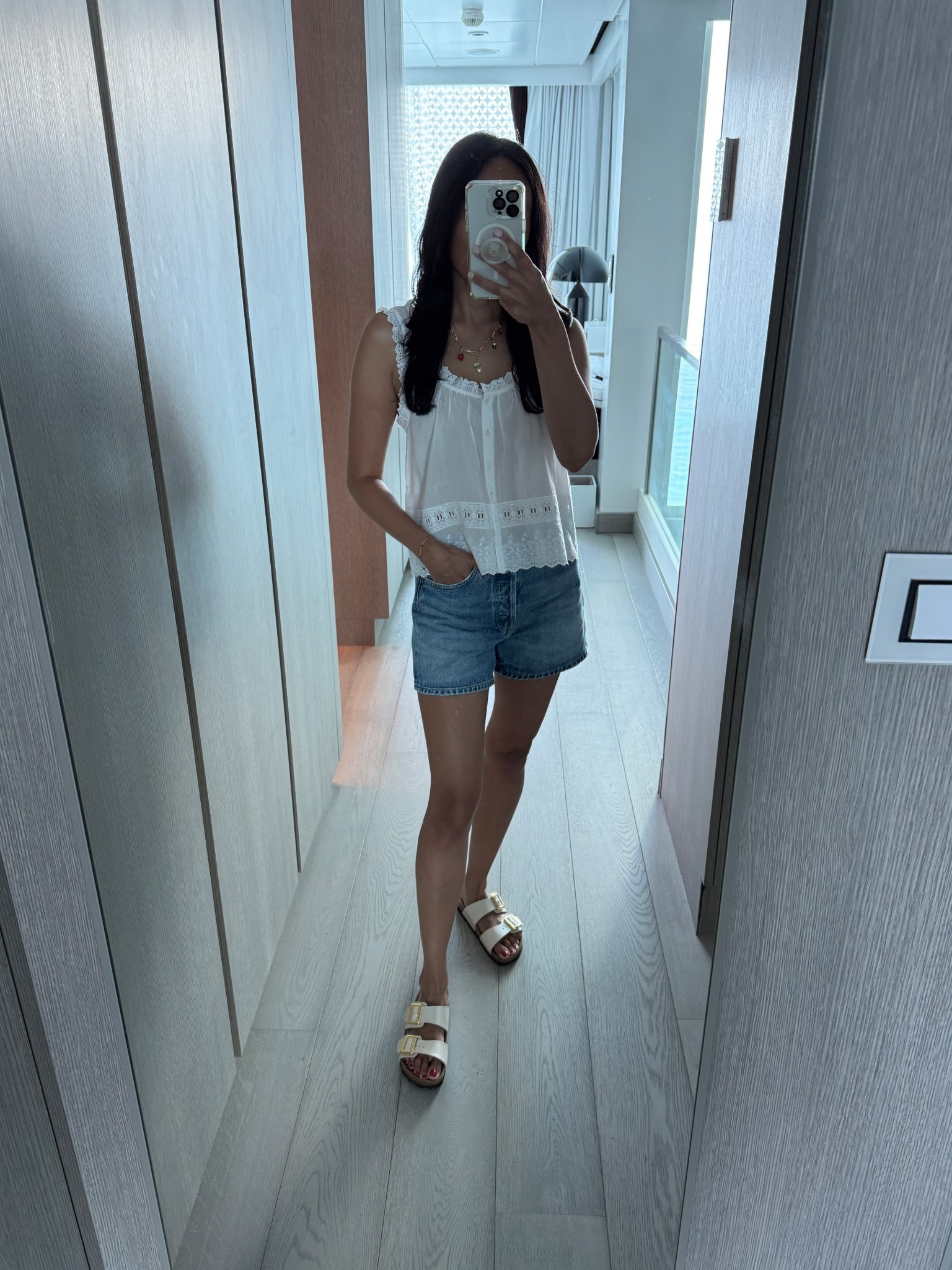 Vacation outfit. 
White top. Tank top. 
Denim shorts. 
Slide sandals. 
Birkenstock. 
Charm necklace  

#LTKOver40 #LTKFindsUnder100 #LTKTravel