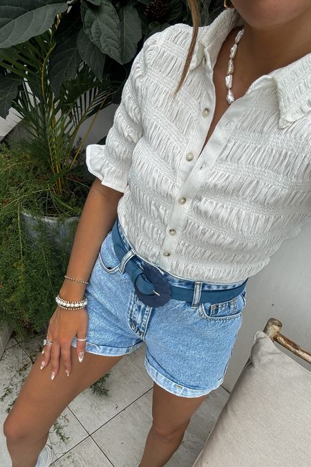 Casual resort wear vacation outfit: button up blouse (small), denim shorts (small in light wash), platform sneakers, and a statement belt 

Summer outfit | casual style | shorts outfit | travel outfit | sightseeing outfit | what to wear on vacation | resort style | tropical style | coconut girl | preppy style 

#LTKstyletip #LTKtravel #LTKSeasonal