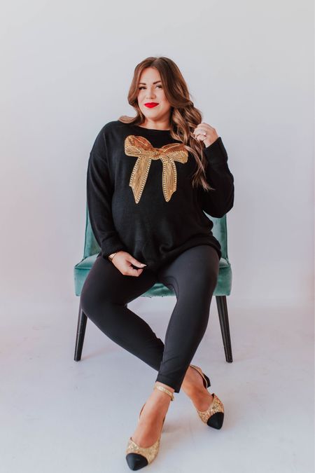 curvy black and gold sequin bow sweater! part of my Merry Pinkmas collection with Pink Desert! i’m in the 2X, typically would take the large not pregnant. runs TTS!  🩷

wearing size 14 in leggings (usually a 10!) 



#LTKmidsize #LTKfindsunder100 #LTKHoliday
