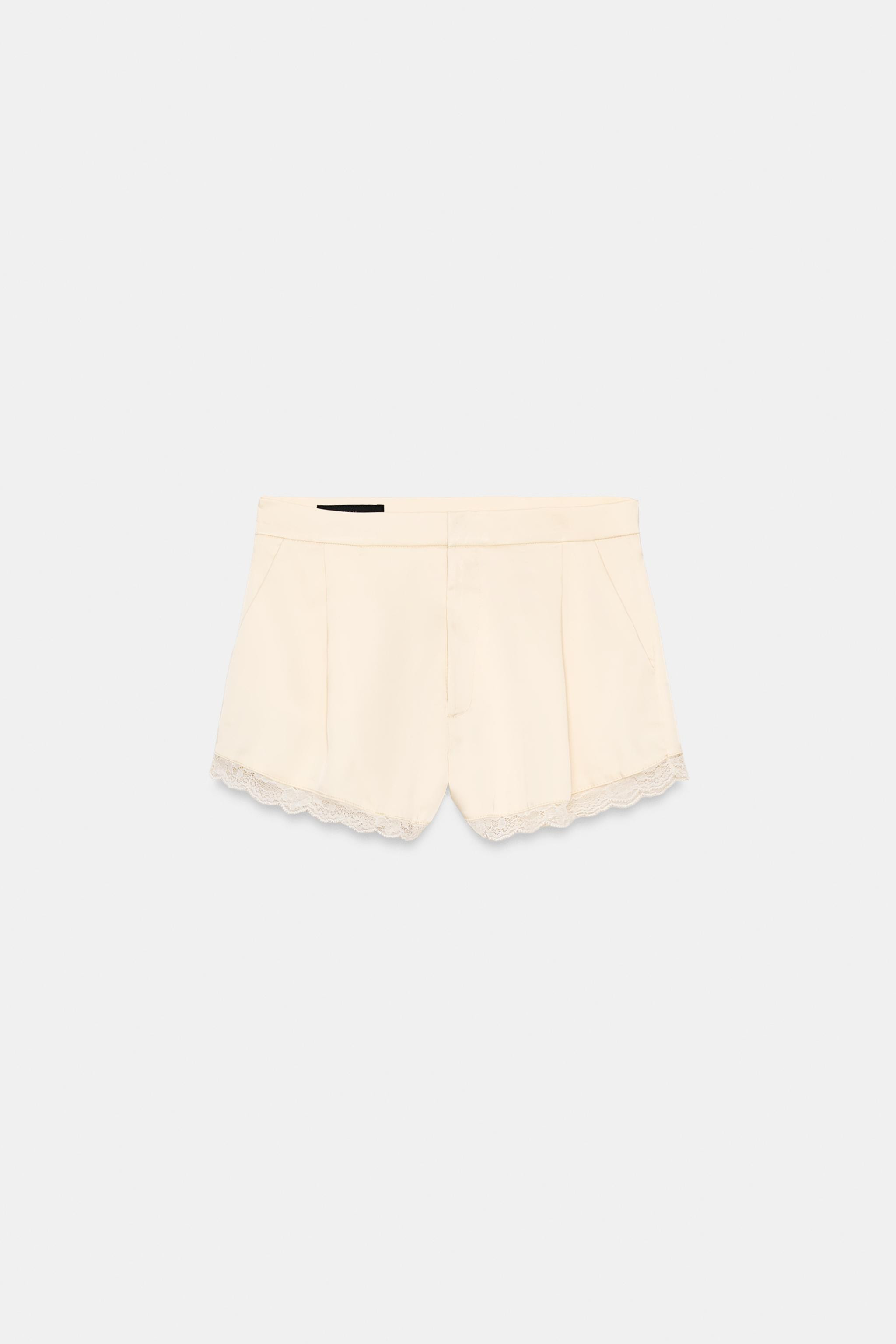 Mid-waisted shorts made of satin fabric. Side pockets. Hem with tonal lace trim. Front pleats. Fr... | Zara US