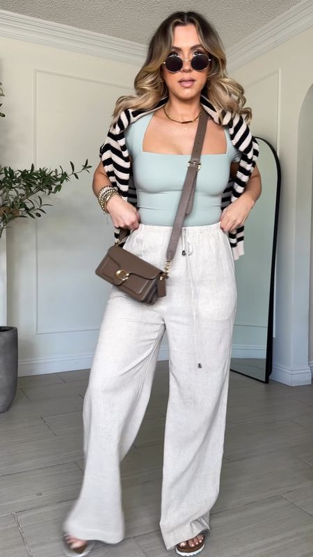 Casual relaxed AMAZON SPRING OUTFIT 😝

🛒 wearing small in bodysuit + linen pants
🛒 bodysuit is in the color SMOKE GREENN
🛒 striped sweater is in the color apricot

I'm 5'3

#LTKSeasonal #LTKsalealert #LTKU