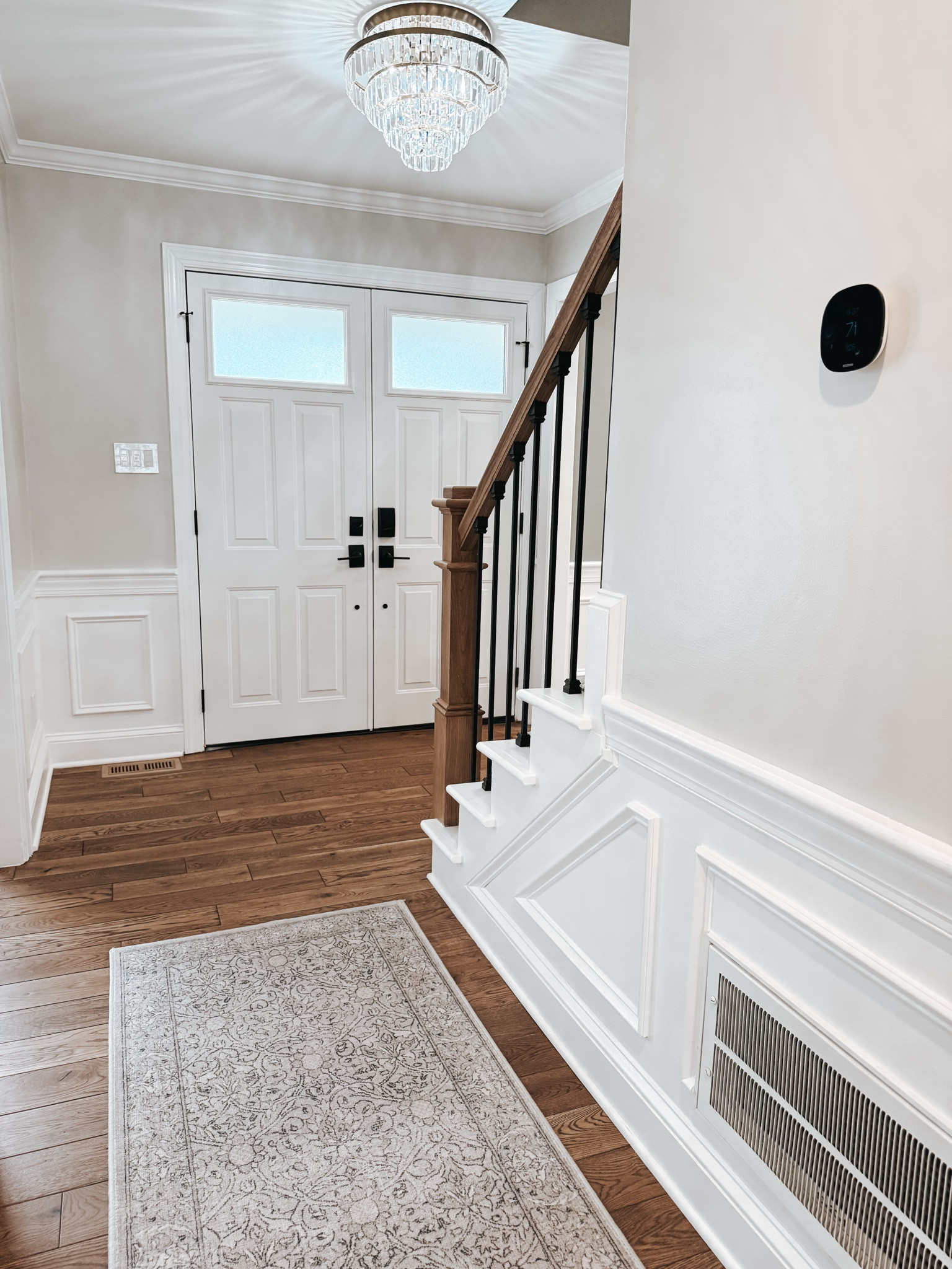 ❤️ Love our entryway after renovations. 💡The Gemma Crystal light fixture from Pottery Barn is so elegant.
🥿This washable ruggable rug looks classic but completely functional.
🌡️And there’s nothing more amazing than being able to adjust our Ecobee thermostat when we’re away from home. 
🔑And make sure our doors are locked wherever we may be.

#LTKHome #LTKMostLoved #LTKTravel