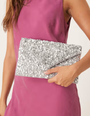 True Decadence all over sequin envelope clutch bag in silver | ASOS (Global)