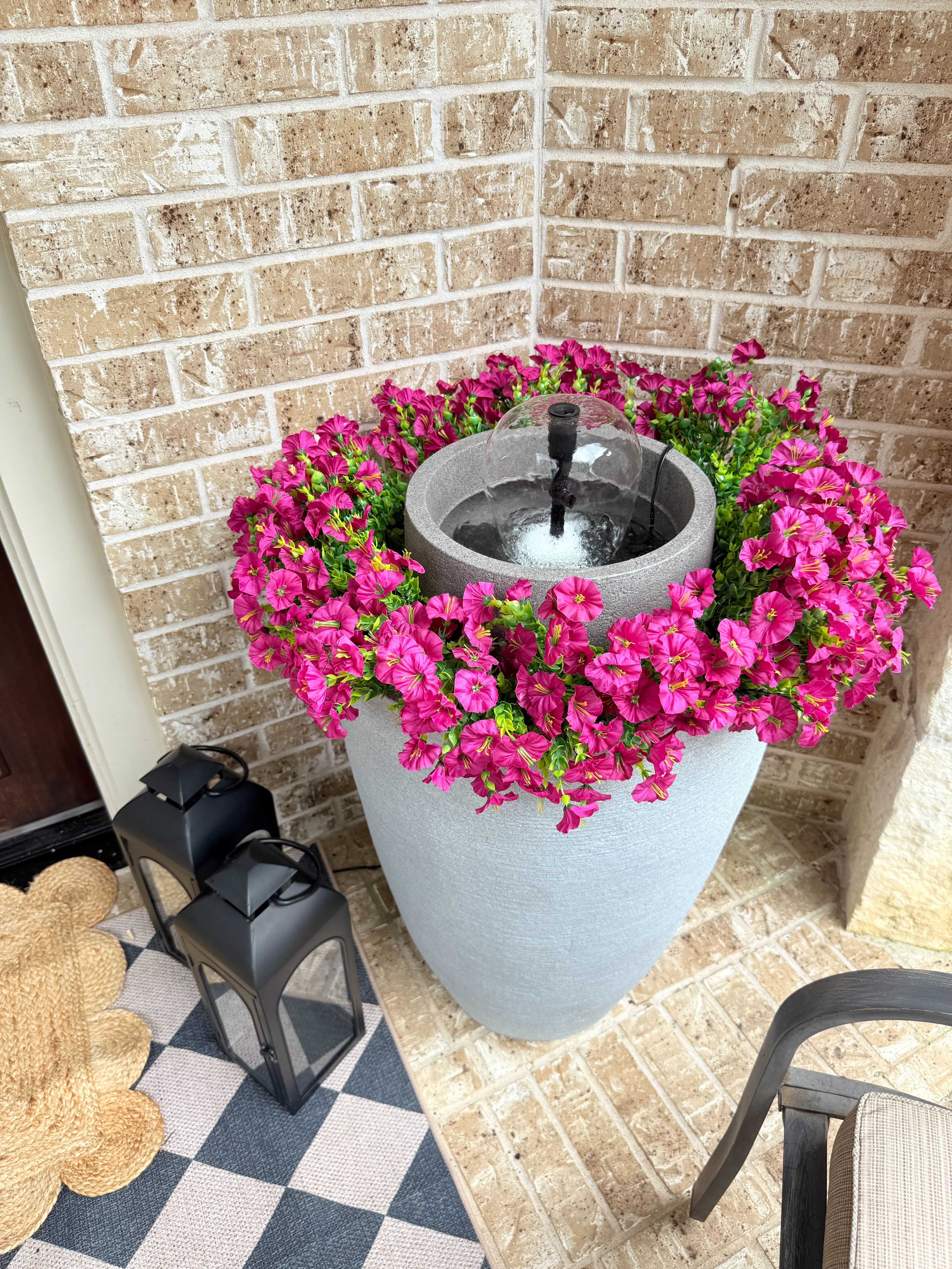 This DIY porch fountain is the prettiest way to make your outdoor space feel more elevated and inviting. The bright florals and soft water feature create such a cozy, beautiful setup for summer 🌸 

 #LTKdayinmylife #LTKSeasonal #LTKHome