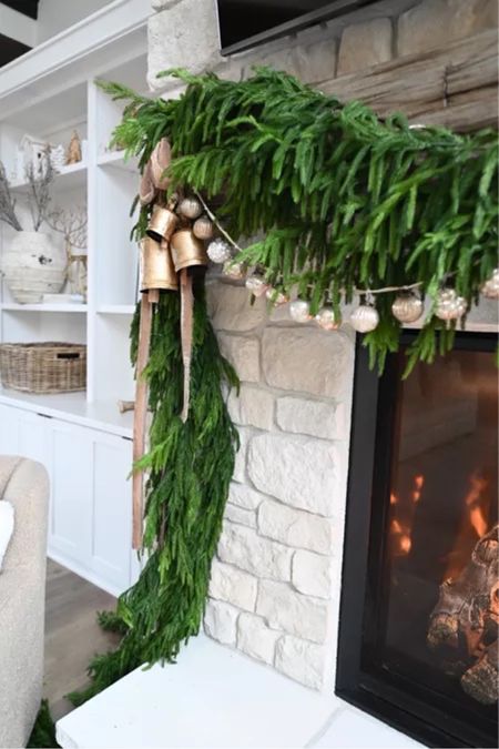A little sneak peek at this years holiday mantle! Hurry - this garland sells quick!

Christmas  Christmas decor  Garland  Cow bells  Ornament  Ornament garland  Mantle  Fireplace  Holiday  Holiday decor  Ribbon  Fairy lights  

#LTKSeasonal #LTKHoliday #LTKhome