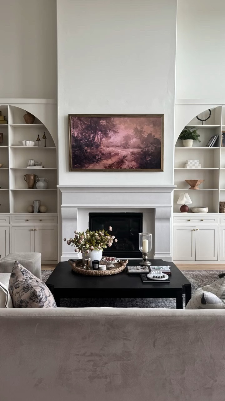 POV, you buy the potential house and bring your vision to life! Our living room makeover was the first big diy project that we did in our home. My husband and my dad built out the fireplace and we hired out the gas insert install (some things are best left to the professionals) and built ins were made by a friend from high school. This project really set the tone for the rest of our home and is a project that I am so proud of! Follow along @ourmountainsidehome_1 for more diy!  DIY fireplace, limestone mantle, built ins, living room, two story living room, before and after, colonial home, 90’s home, neutral living room, open concept, fixer upper home.  #diy #beforeandafters #diyfireplace #nancymeyersaesthetic #builtins