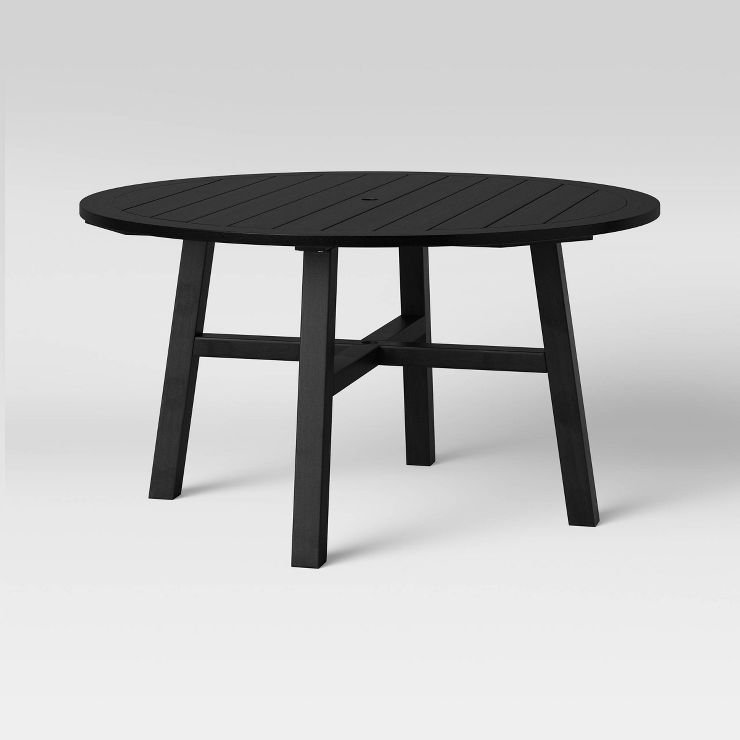 Black patio dining table with a round, slatted tabletop | Target