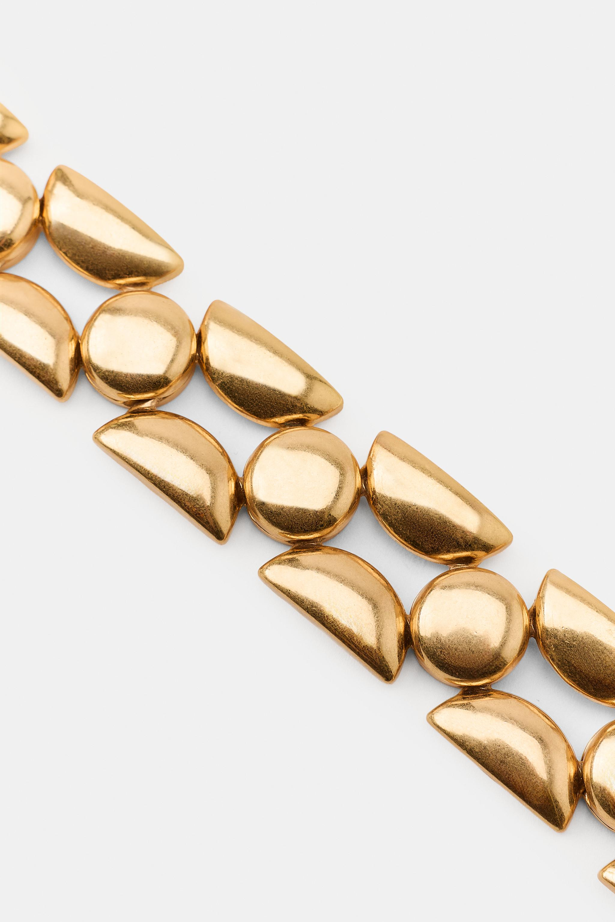 Metal choker-style necklace with multiple pieces in different shapes and sizes. Lobster clasp clo... | Zara US