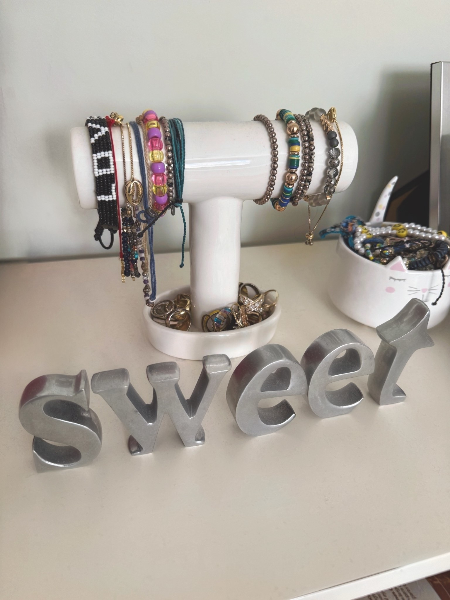 Jewelry organization for a kids room that also adds a little room decor… it’s a ceramic t-bar bracelet holder stand w a ring holder at the bottom. 

#LTKKids #LTKHome #LTKSaleAlert