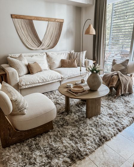 cozy living room Sunday vibes 

area rug, olive tree and planter, cabinet, sideboard, buffet table, console table, coffee table, accent chair, swivel chair, boho art, fiber art, end table, throw pillow, throw blanket, neutral decor,  neutral home, living room decor, organic modern living room, reclining sofa, white sofa 

#LTKhome