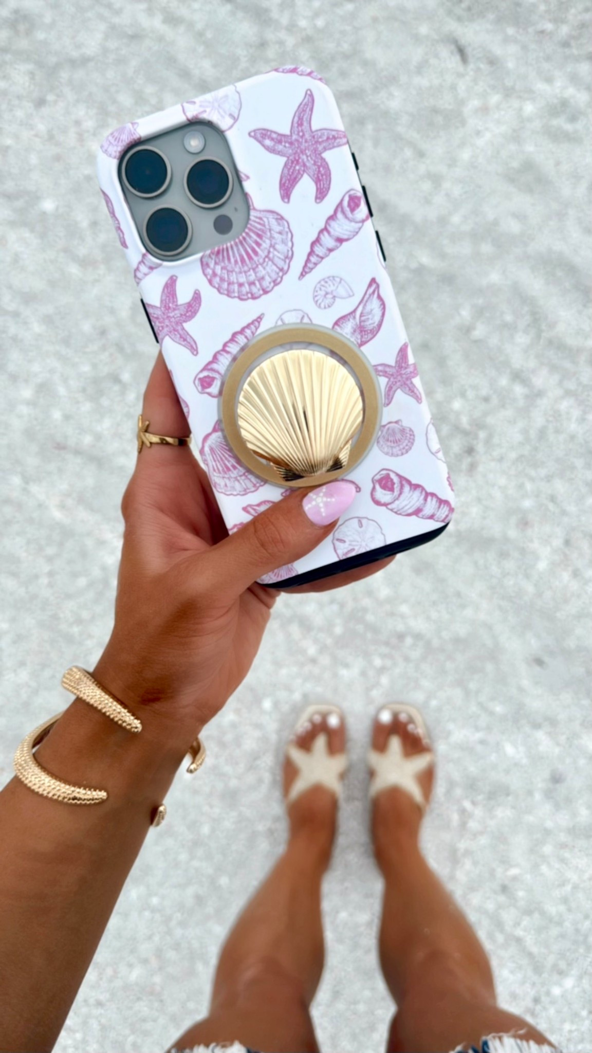 Beach Accessories: Sea Shell Pop Socket to hold your phone safely, pink shell phone case, starfish gold bracelet on SALE (25% OFF at Nordstrom), sea shell ring, + starfish sandals! 

Perfect to style with your summer outfit, beach vacation outfit, or resortwear look. 

#LTKSeasonal #LTKTravel #LTKSaleAlert