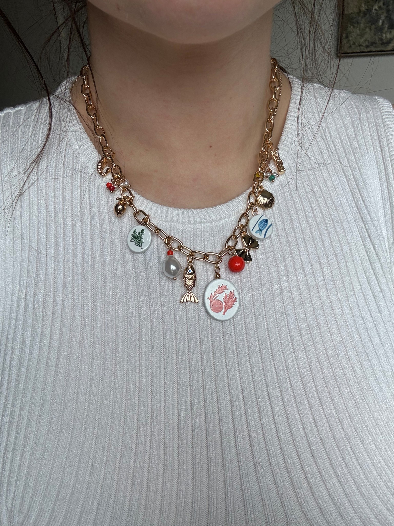 Loving this charm necklace & it’s on sale right now for under $13 🩵🍓🐚 🦀 

#LTKSaleAlert #LTKFindsUnder50 #LTKU
