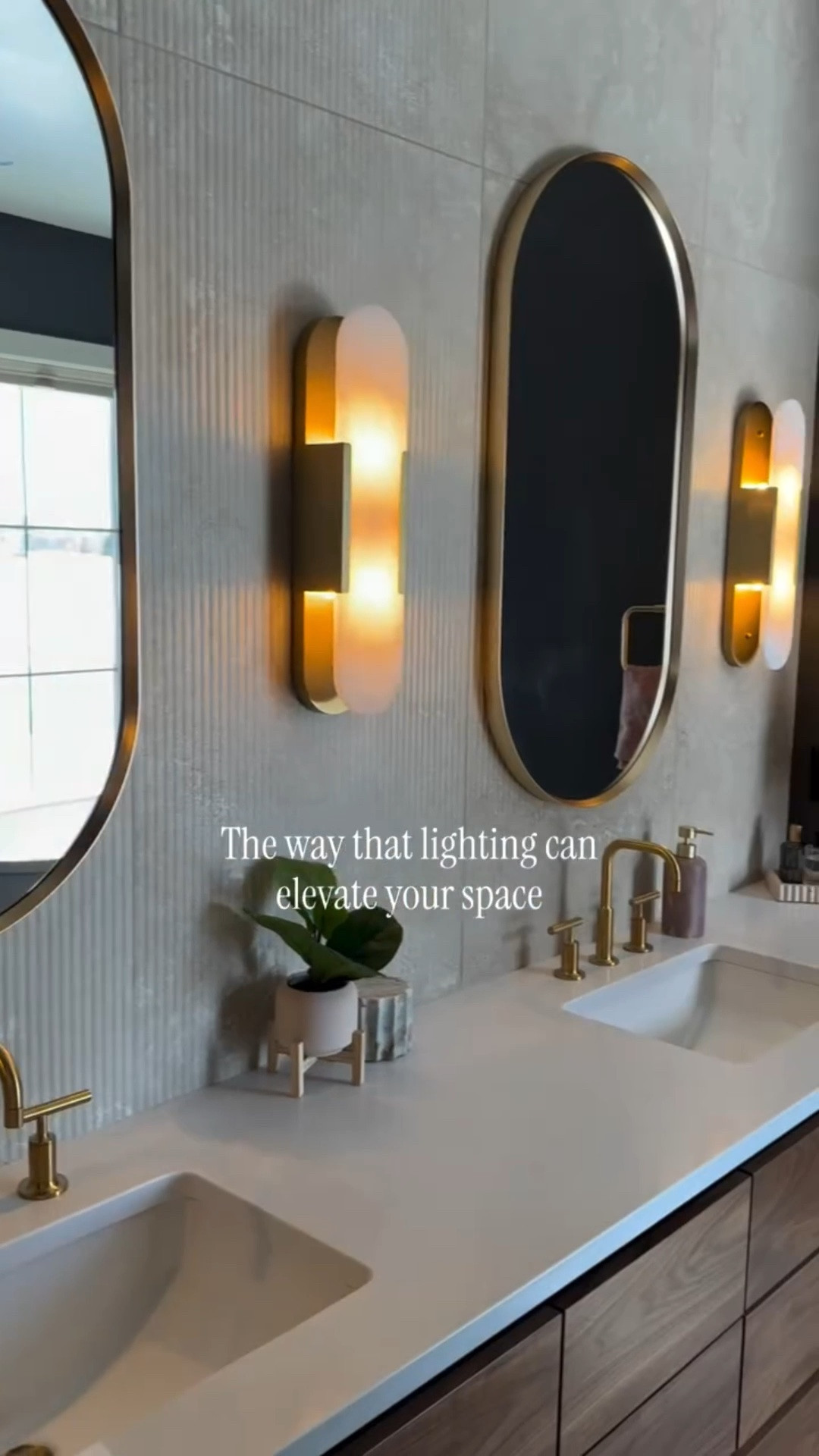 The bathroom lights add such a moody, calm vibe to our primary bathroom. Paired with the earthy tones, it truly feels like a relaxing spa in here. 🤎✨

Primary bathroom lights | primary bathroom inspo | moody primary bathroom | best lights for a bathroom