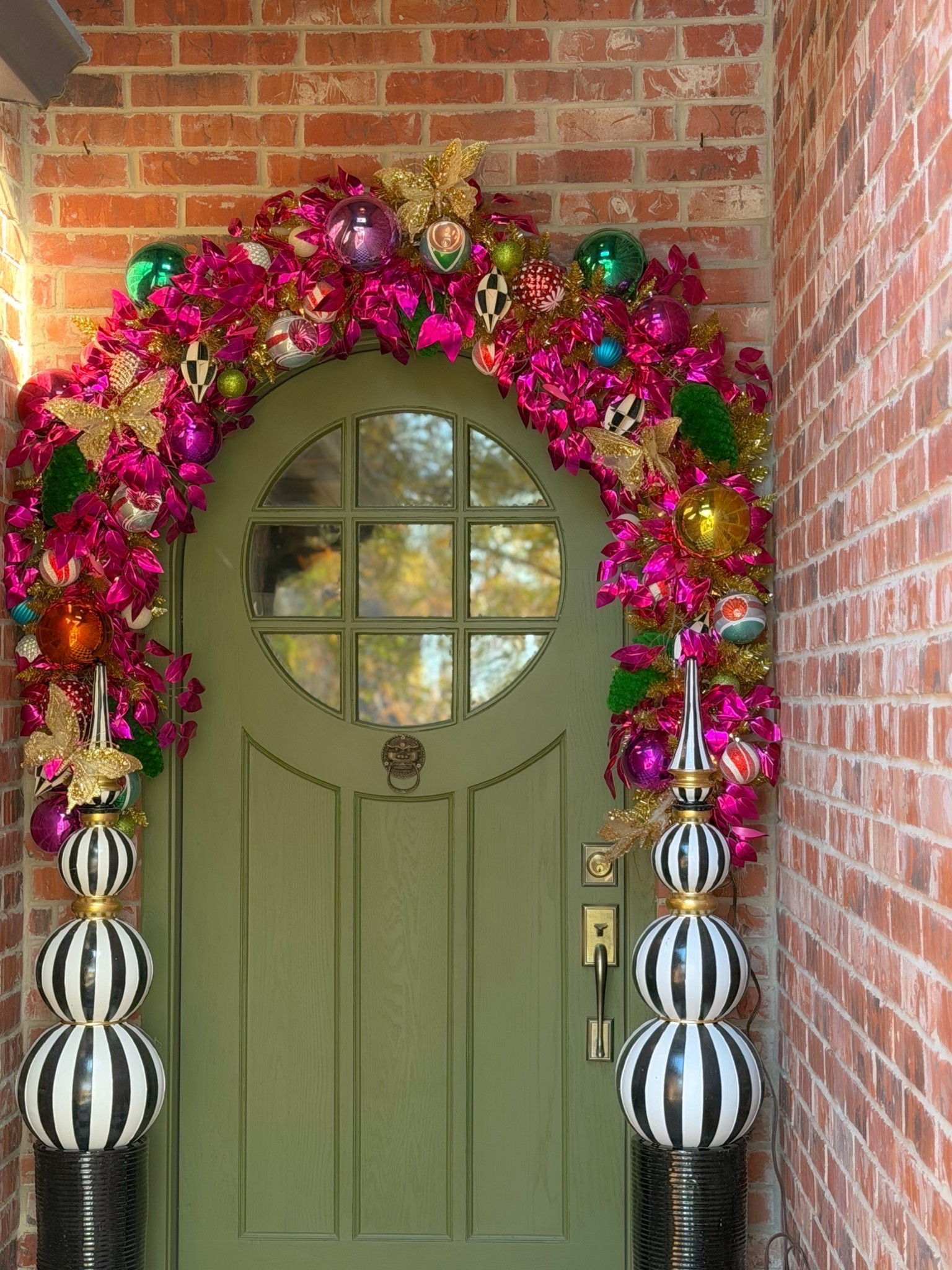 A festive first impression ✨
This year’s entry is full of color, shine, and oversized charm. Linking similar garland pieces, ornaments, and finials so you can recreate the look.

#ChristmasDecor #HolidayFrontDoor #MaximalistChristmas

#LTKHoliday #LTKHome